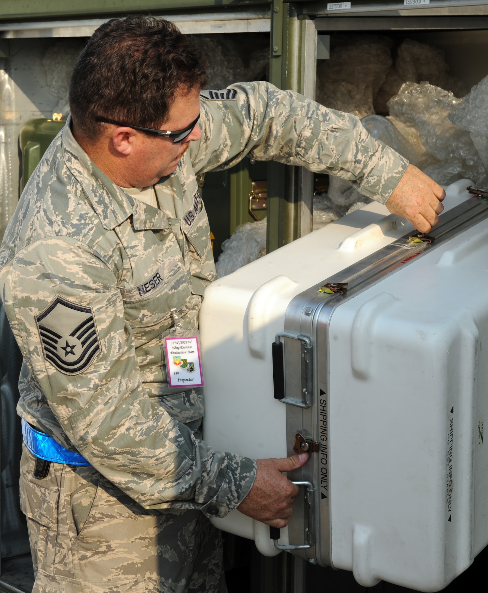 LANGLEY AIR FORCE BASE, Va. -- Master Sgt. Michael Neser, 1st Communications Squadron asset management non-commissioned officer in charge, inspects cargo for a Phase I Operational Readiness Exercise here Aug. 27. The ORE is designed to establish Langley's expeditionary readiness and efficiency in deploying Airmen. More than 2,500 Airmen will be involved in the exercise, which will measure the 1 FW's capabilities on graded, step-by-step guidelines which involve preparing aircraft, cargo and Airmen to deploy seamlessly within an established period of time. (U.S. Air Force photo/Airman1st Class Jonathan Koob)