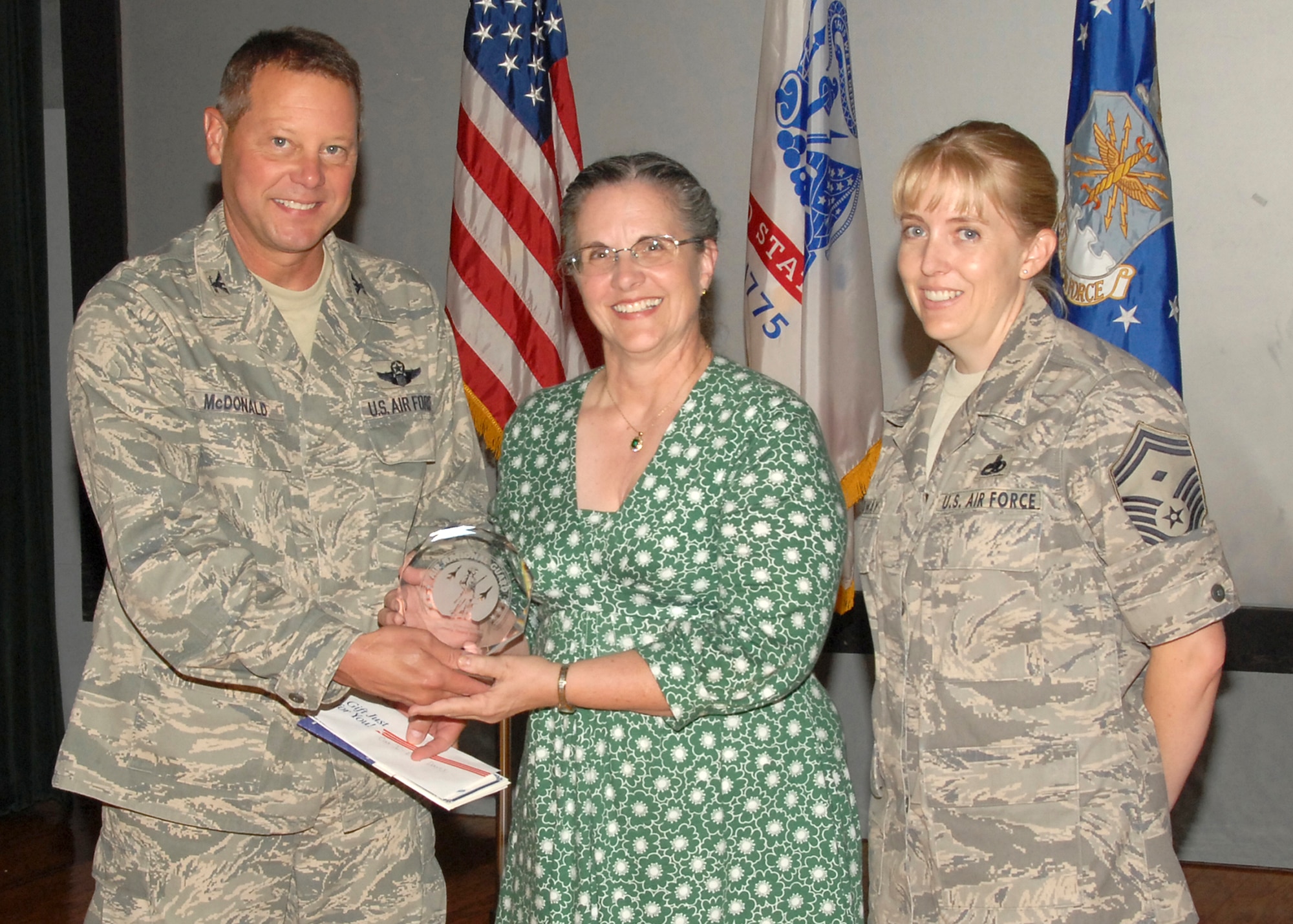 ANDREWS AIR FORCE BASE, Md. - Col. Michael J. McDonald, the commander of the Air National Guard Readiness Center, presents the Civilian of the Quarter, Category 1 award to Edna C. Davis, a secretary at The I.G. Brown Air National Guard Training and Education Center, McGhee Tyson Air National Guard Base, Tenn., on Aug. 21. (U.S. Air Force photo by Master Sgt. Jerry R. Bynum)(Released)