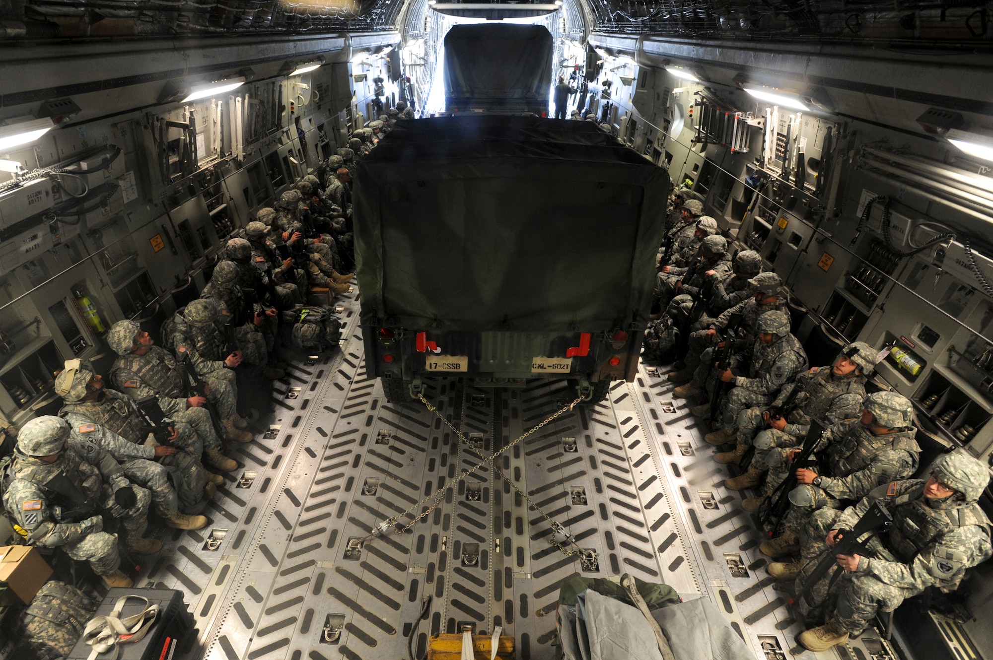 ELMENDORF AIR FORCE BASE, Alaska -- Members from the 17th Combat Service Support Battalion out of Fort Richardson, wait on board a C-17 Globemaster III prior to take off, August 24, for Arctic Response.  Arctic Response was a joint operation and total force integration exercise where Air Force active-duty and National Guard members aided the Army in deploying to the exercise site. (U.S. Air Force photo/ Staff Sgt. Joshua Garcia)