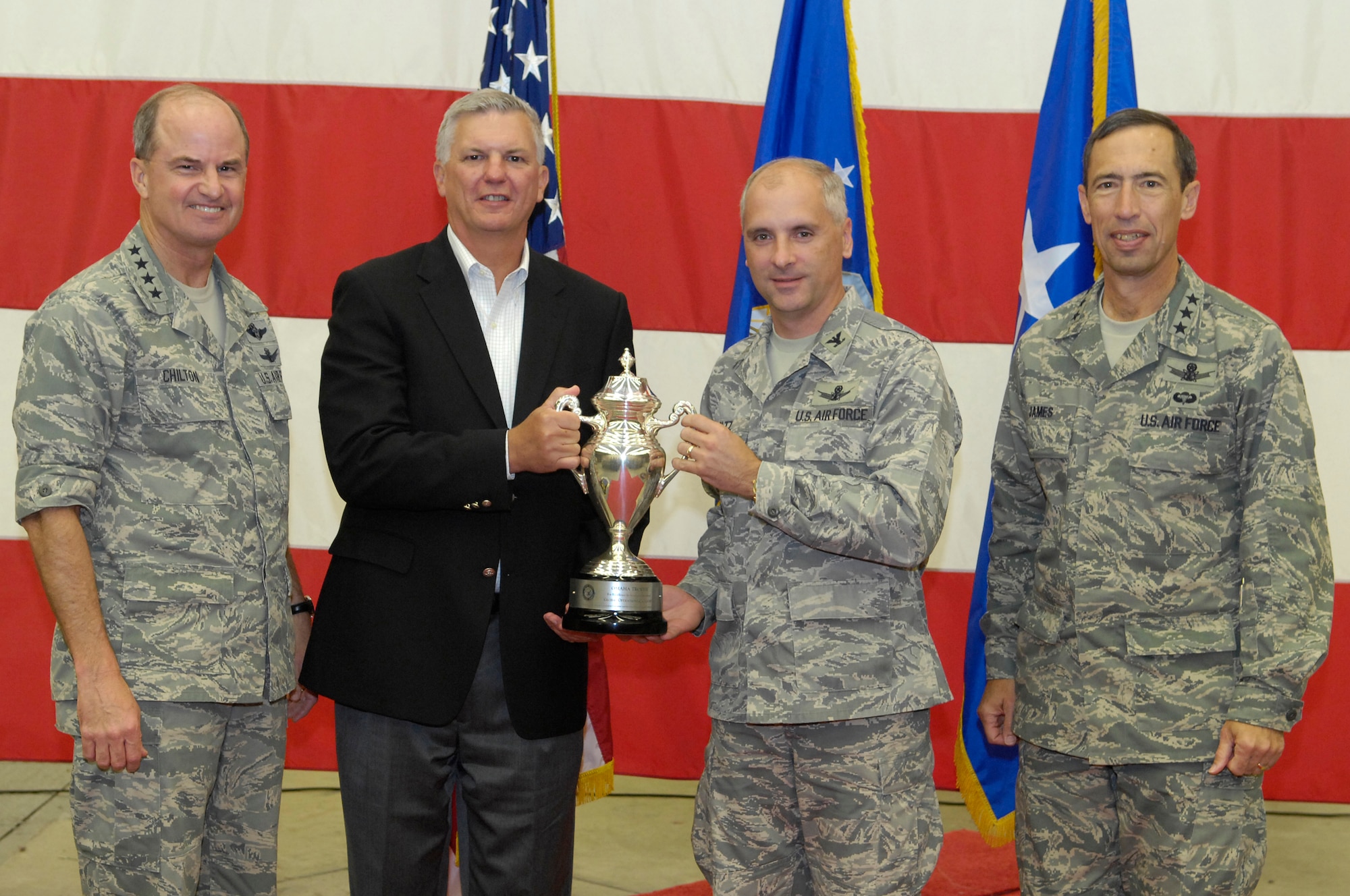 VANDENBERG AIR FORCE BASE, Calif. --  (From left) Gathering together during a ceremony at the Joint Space Operations Center here, Gen. Kevin Chilton, the commander of the U.S. Strategic Command, Gary Gates, a member of the Strategic Command Consultation Committee, Col. Richard Boltz, the 614th Air and Space Operations Center commander and director of the JSpOC, and Lt. Gen. Larry James, the 14th Air Force commander, pose with the Omaha Trophy on Aug. 26. The JSpOC won the trophy in the Global Operations category. (U.S. Air Force photo/Airman 1st Class Andrew Lee)