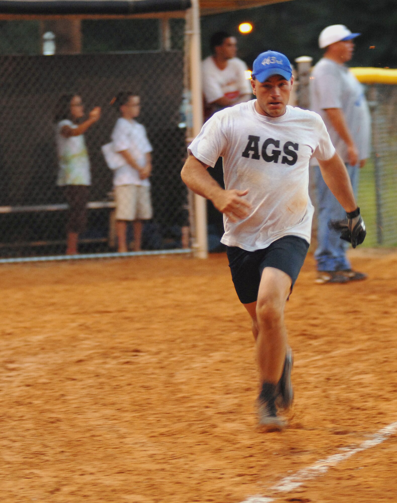 Eric Turner, 19th AMXS team member, sprints for home base Aug. 20 during the base intramural softball championship game. The 19th AMXS beat the 19th MDG 22 - 11.