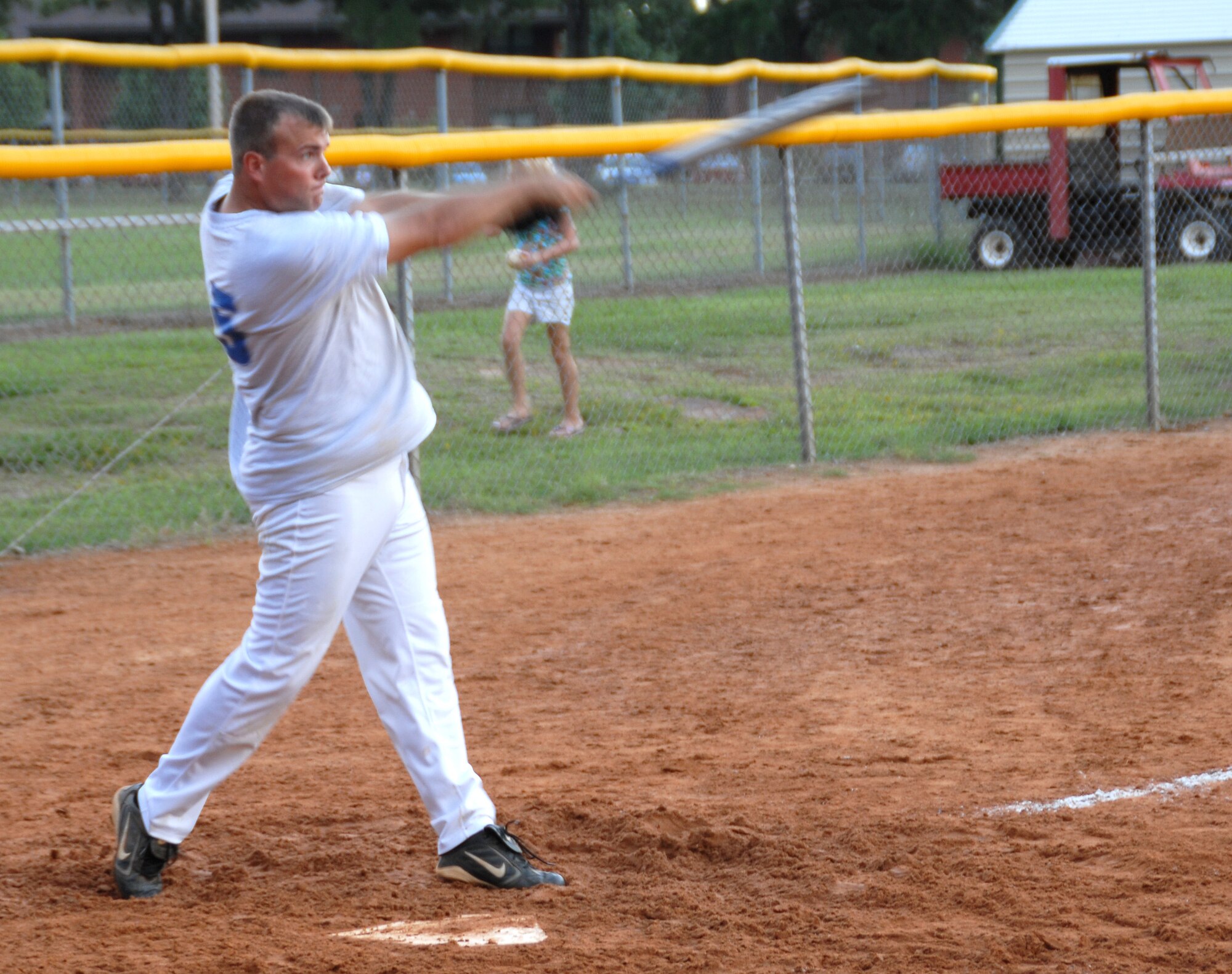 Cody Rogers, 19th AMXS team member, drives the ball into the outfield Aug.20 during the base intramural softball championship game. The 19th AMXS beat the 19th MDG 22 - 11.