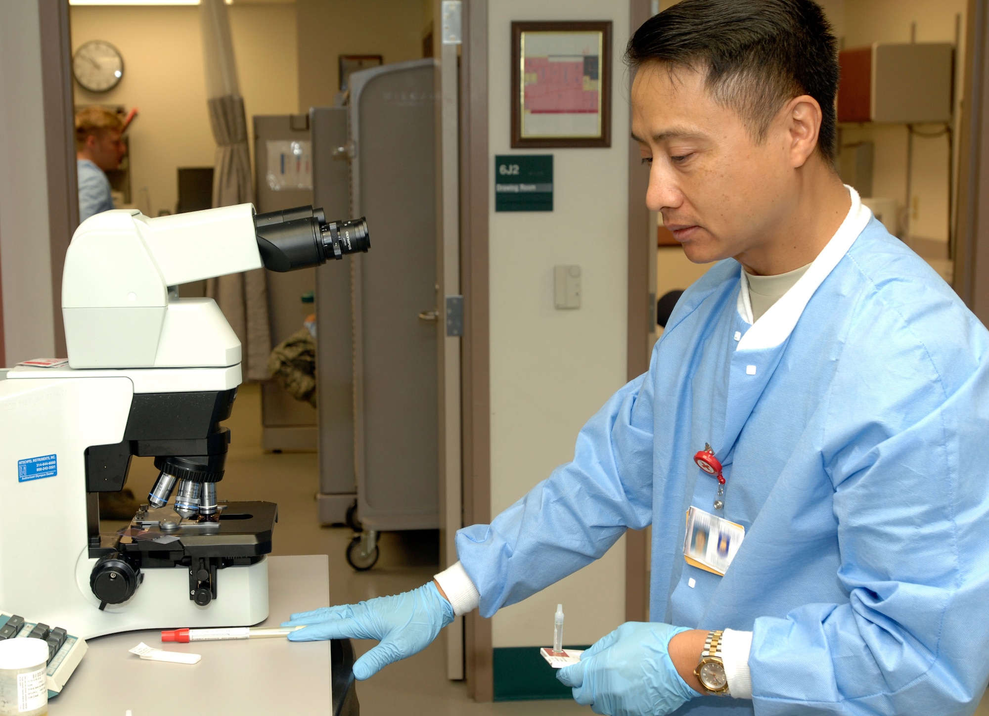Master Sgt. Mike Bouddhara, 184th Intelligence Wing, Kansas Air National Guard, screens a patient sample for strep-throat causing bacteria at the McConnell Air Force Base, Kan., medical clinic laboratory Aug. 26. Lab technicians here identify organisms and parasites using microbiology to classify viruses, test enzyme levels, and they use metabolic chemistry to make sure patients' organs are functioning properly. (U.S. Air Force photo/ Senior Airman Jessica Lockoski)