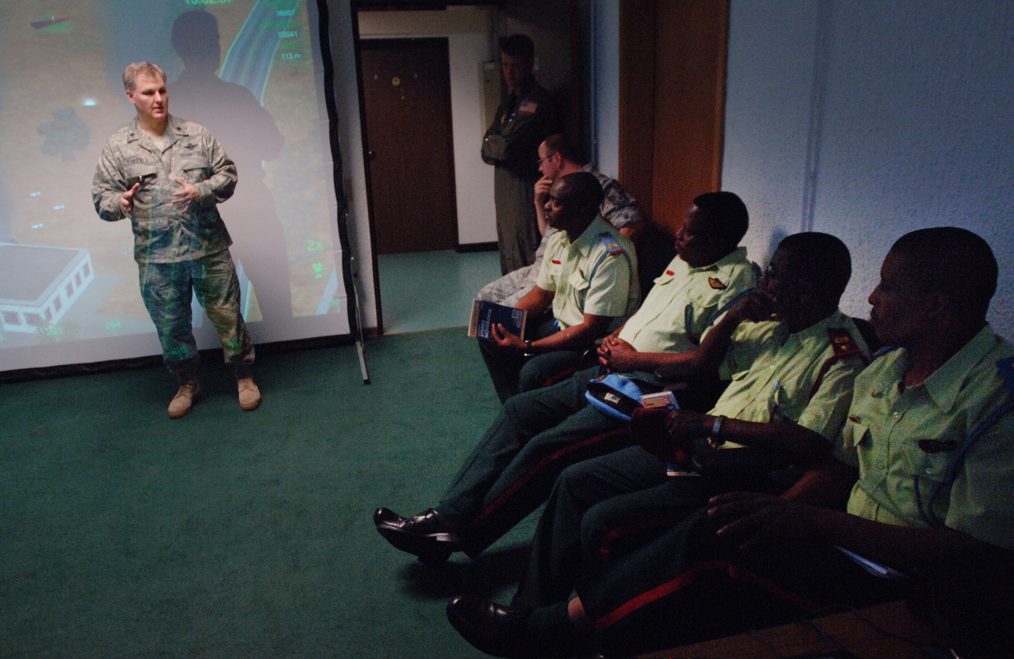 Lt. Col. Tony Forkner, the commander of the U.S.Air Forces Europe Air-Ground Operations School, briefs guests from Botswana prior to the close air support simulator demonstration.  They are the first African military delegation to visit the facility. (U.S. Air Force Photo by Master Sgt. Donald Wagers.)
