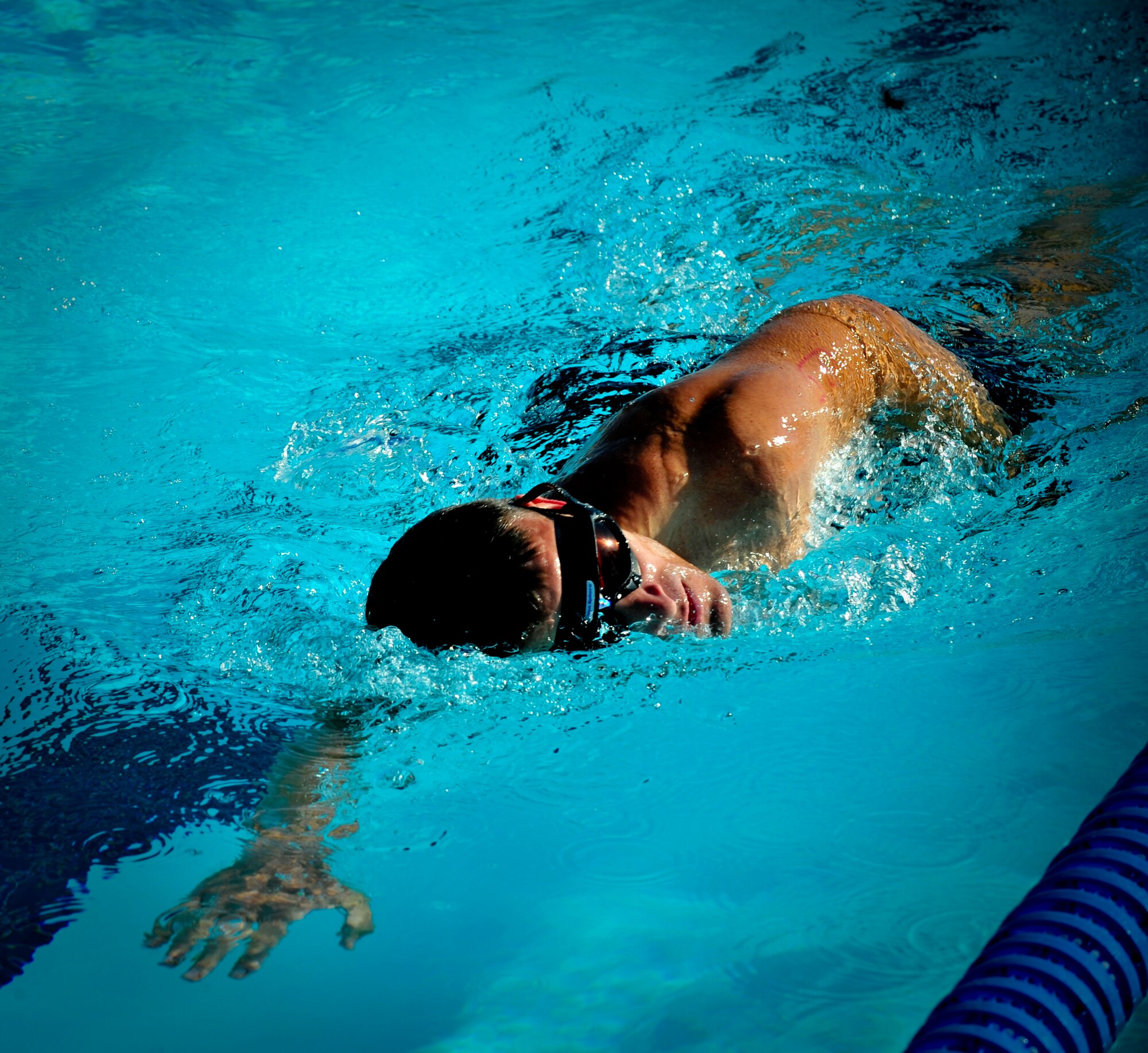 CANNON AIR FORCE BASE, N.M. -- Capt. Travis Hinkle, 3rd Special Operations Squadron, leads in the 500m swim in the mini triathlon hosted by 27 Special Operations Force Support Squadron here, Aug. 22. Captain Hinkle placed first in the second heat and fifth overall in the competition with a time of one hour, four minutes, 14 seconds. He led the entire heat, in the 500 meter swim, five kilometer bike ride, and five kilometer run. 