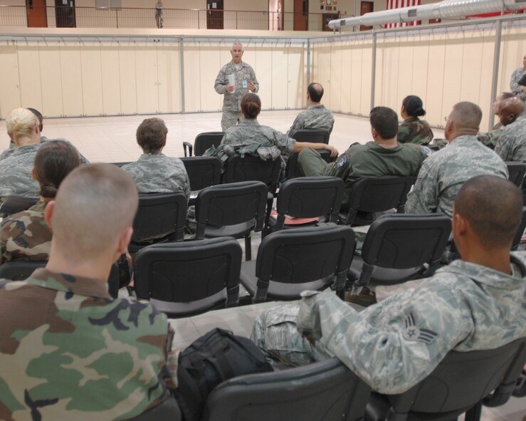 Maj. (Chaplain) Mark Crumpton, 39th  Air Base Wing, briefs deploying personnel on receiving chaplain assistance while “down-range” and for their family while  deployed, during a deployment exercise, Wednesday, Aug. 26, 2009, Incirlik Air Base, Turkey. Participants from each  squadron  packed a duffel bag of uniforms and personal hygiene items before processing to deploy to a fictitious location. (U.S. Air Force photo/Staff Sgt. Lauren Padden)