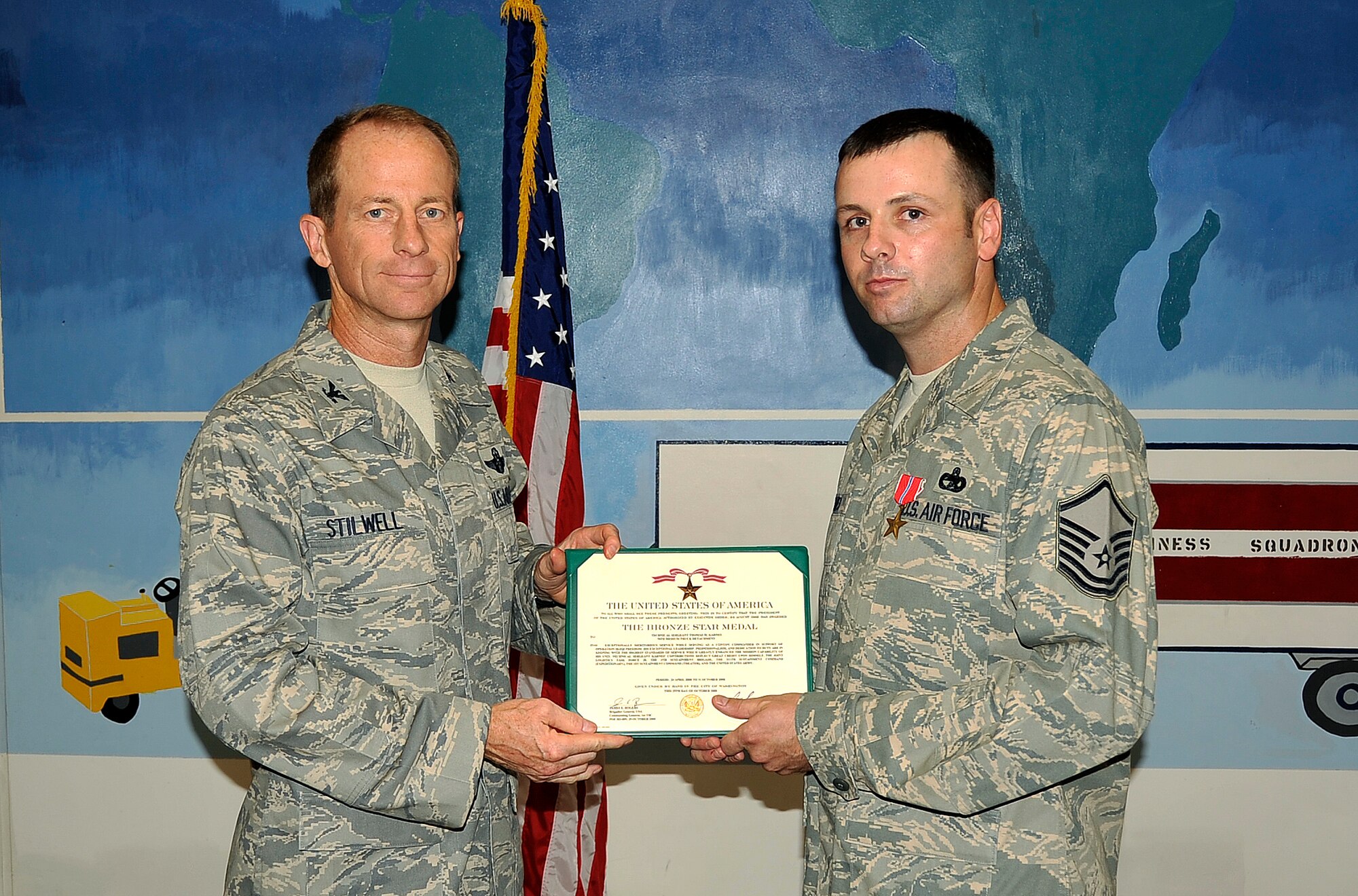 MISAWA AIR BASE, Japan -- Master Sgt. Thomas Karnes, 35th Logistics Readiness Squadron vehicle operations supervisor, holds his certificate after receiving his second Bronze Star for his achievements in Operation Iraqi Freedom August 27.  The Bronze Star is the fourth highest combat award of the U.S. Armed Forces. (U.S. Air Force photo/Staff Sgt. Chad C. Strohmeyer)