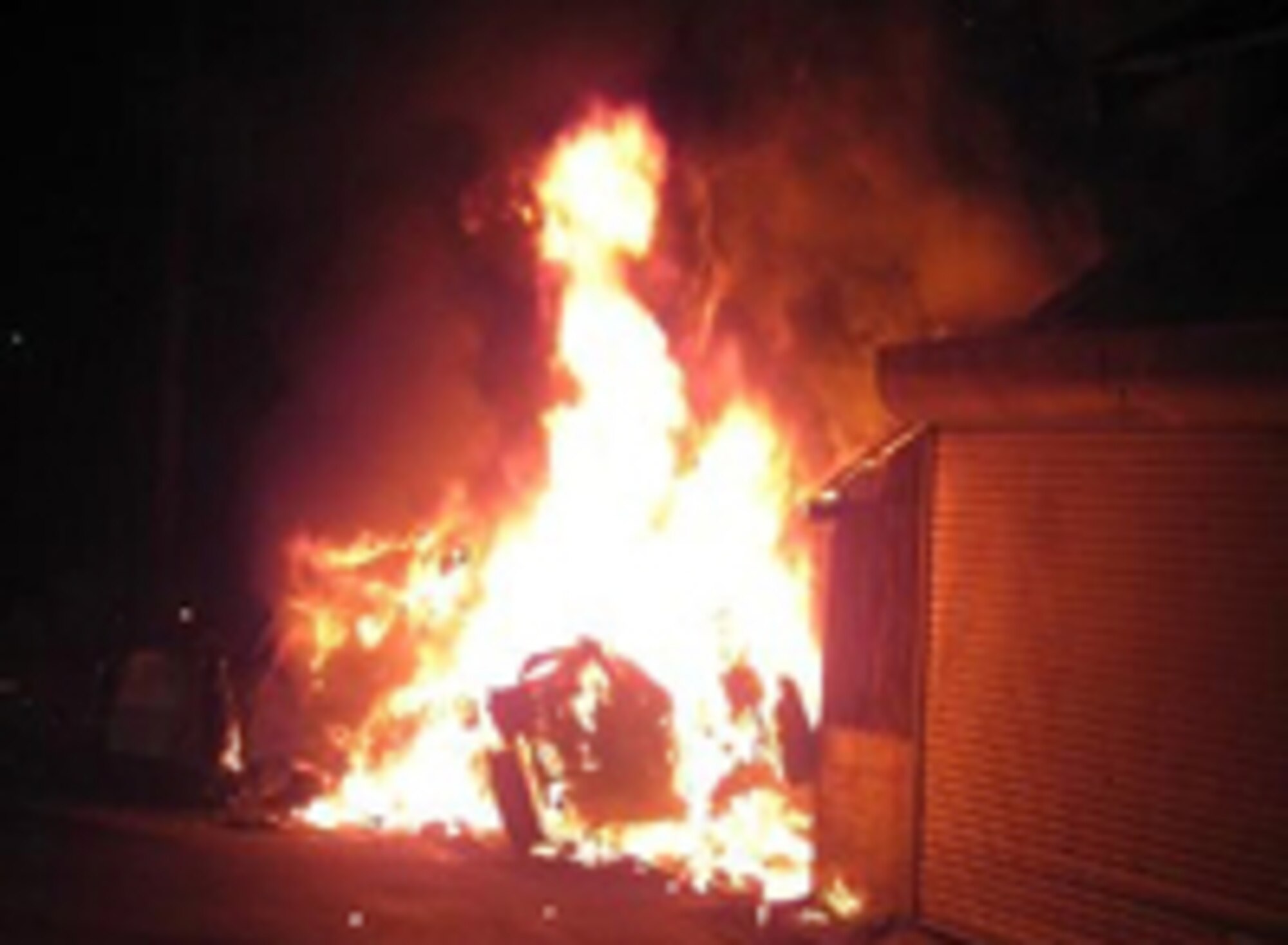 MISAWA AIR BASE, JAPAN--A car driven by a Japanese citizen collided with a house and burst into flames Aug. 15 in Towada, Japan. Eight Airmen from Misawa assisted in rescueing the driver of the vehicle. (Photo courtesy of Senior Airman Thomas Sullivan)