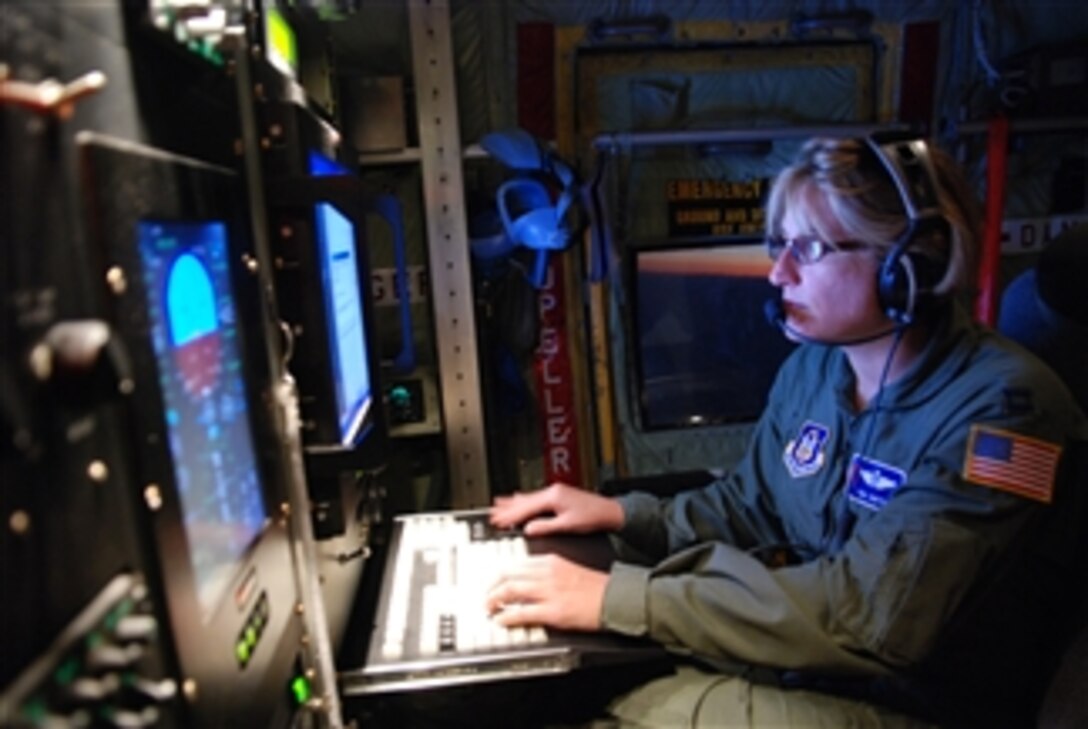 U.S. Air Force Capt. Tina Smith, a meteorologist with the 53rd Weather Reconnaissance Squadron, monitors data obtained during a 10-hour mission through tropical storm Felicia at Hickam Air Force Base, Hawaii, on Aug. 9, 2009.  The unit, also known as the Hurricane Hunters, operates the WC-130J Hercules aircraft for weather reconnaissance into some of the most violent storms on Earth.  Hurricane Felicia reached peak strength as a category 4 storm with sustained winds of more than 145 mph.  