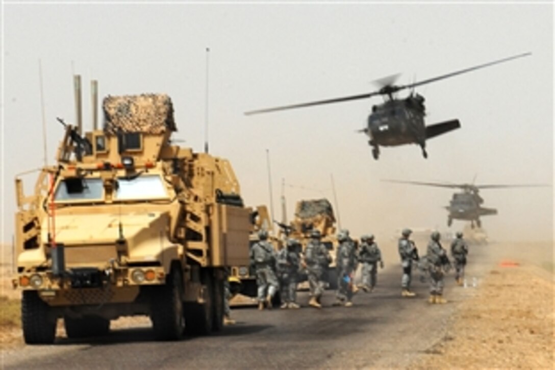 U.S. Army soldiers arrive by air and convoy to help Iraqi soldiers provide urgent humanitarian assistance to the citizens of Faddaqhryah and Bahar in Basra province, Iraq, Aug. 18, 2009. The soldiers are assigned to the 4th Infantry Division's 17th Fires Brigade, 2nd Brigade Combat Team. 