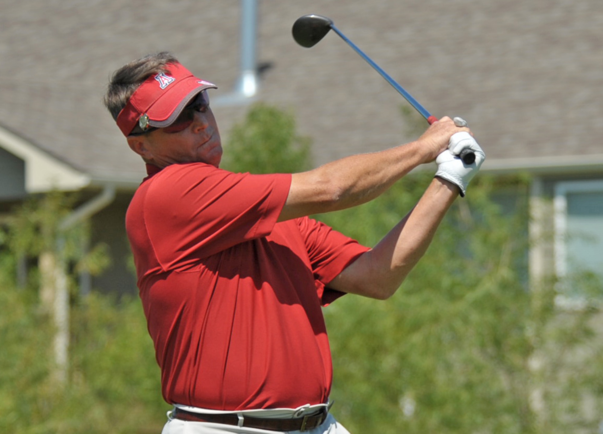 Lt. Col. Greg Harney keeps his eye on the ball after teeing off Friday at Auburn Hills Golf Course, Wichita, Kan. Harney teamed with Col. (retired) Ron Johnston to earn a second straight McConnell Air Force Base Intramural Championship for the 931st Air Refueling Group. (U.S. Air Force photo/Tech. Sgt. Jason Schaap)