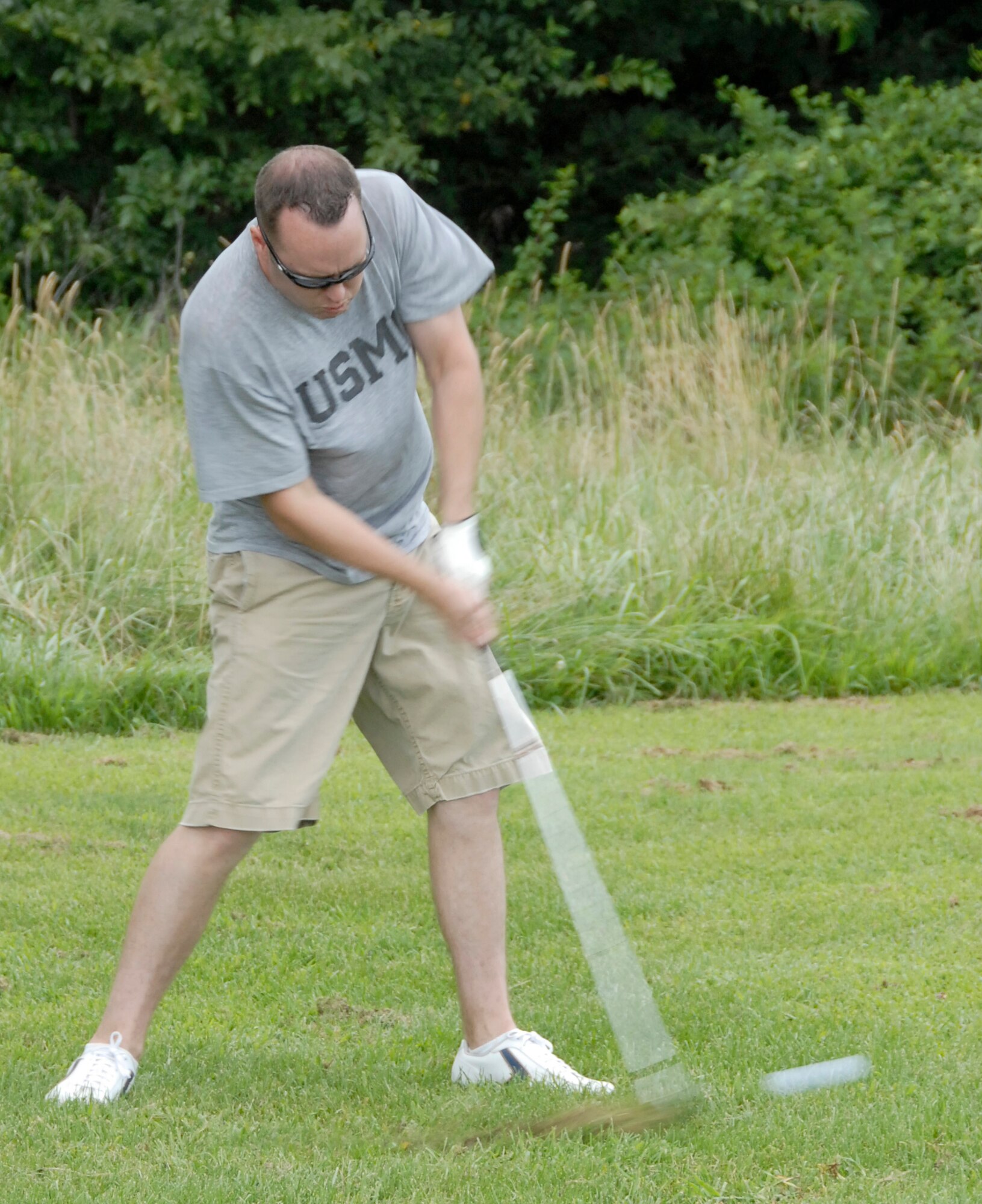 Staff Sgt. Micah Gaches, 442nd Maintenance Squadron, makes a shot from the fairway at the Royal Oaks Golf Course, Whiteman Air Force Base, Mo.  Sergeant Gaches participated in a charity golf tournament to benefit the Wright Flight program.  Wright Flight is a program to teach kids self determination and goal setting using aviation as its theme.  Many members of the 442nd Fighter Wing volunteer their time for the Wright Flight program through the wing's Human Resources Development Council.  The tournament raised more than $1,500 for the program. The 442nd is an Air Force Reserve wing based at Whiteman. (U.S. Air Force photo/Tech. Sgt. John Vertreese)