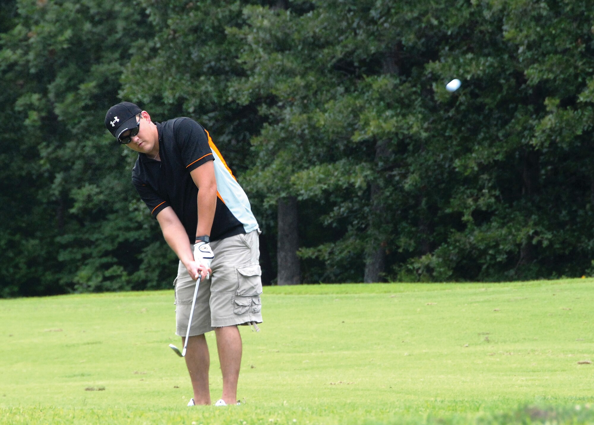 Staff Sgt. Joel Keltner, 442nd Civil Engineer Squadron. makes a fairway shot toward hole number four at the Royal Oaks Golf Course, Whiteman Air Force Base, Mo., Aug. 1, in a charity golf tournament to benefit the Wright Flight program.  Wright Flight is a program to teach kids self determination and goal setting using aviation as its theme.  Many members of the 442nd Fighter Wing volunteer their time for the Wright Flight program through the wing's Human Resources Development Council.  The tournament raised more than $1,500 for the program. The 442nd is an Air Force Reserve wing based at Whiteman. (U.S. Air Force photo/Maj. David Kurle)