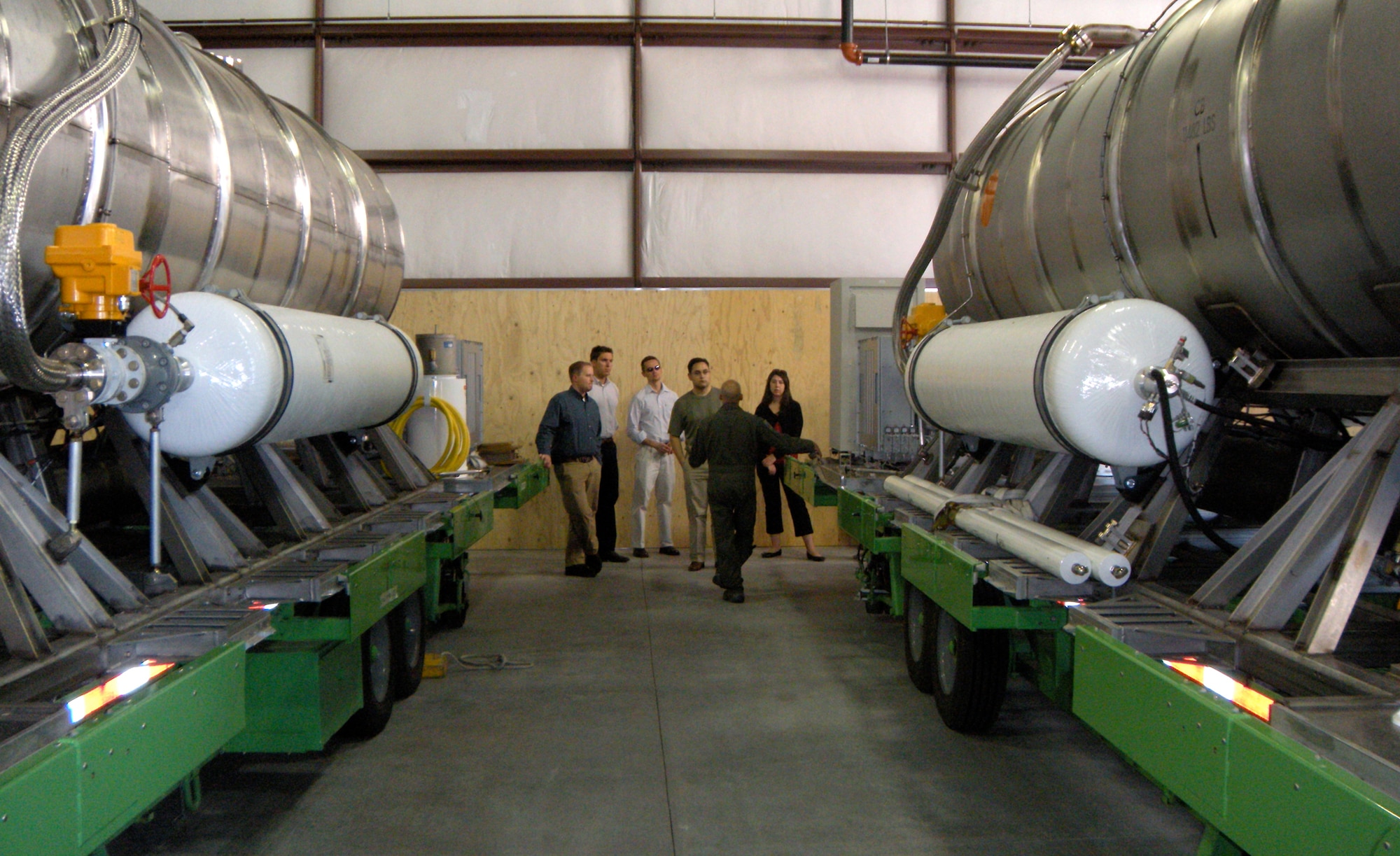 Lt. Col. David Condit, 302nd Airlift Wing chief of safety and Modular Airborne Firefighting Systems coordinator for the Air Force Reserve, talks about the 'MAFFS II' system to Congressional staffers August 27 at Peterson Air Force Base, Colo. The staffers, from Colorado, California and Delaware, visited the 302nd AW after receiving a 'From The Field' brief in early August on the AF Reserve's civil support mission of aerial firefighting, located exclusively at Peterson. The staffers also received a local orientation flight through the Rocky Mountains, giving them a better understanding of the capabilities of the C-130 Hercules tactical transport aircraft. (U.S. Air Force photo/Staff Sgt. Stephen J. Collier)