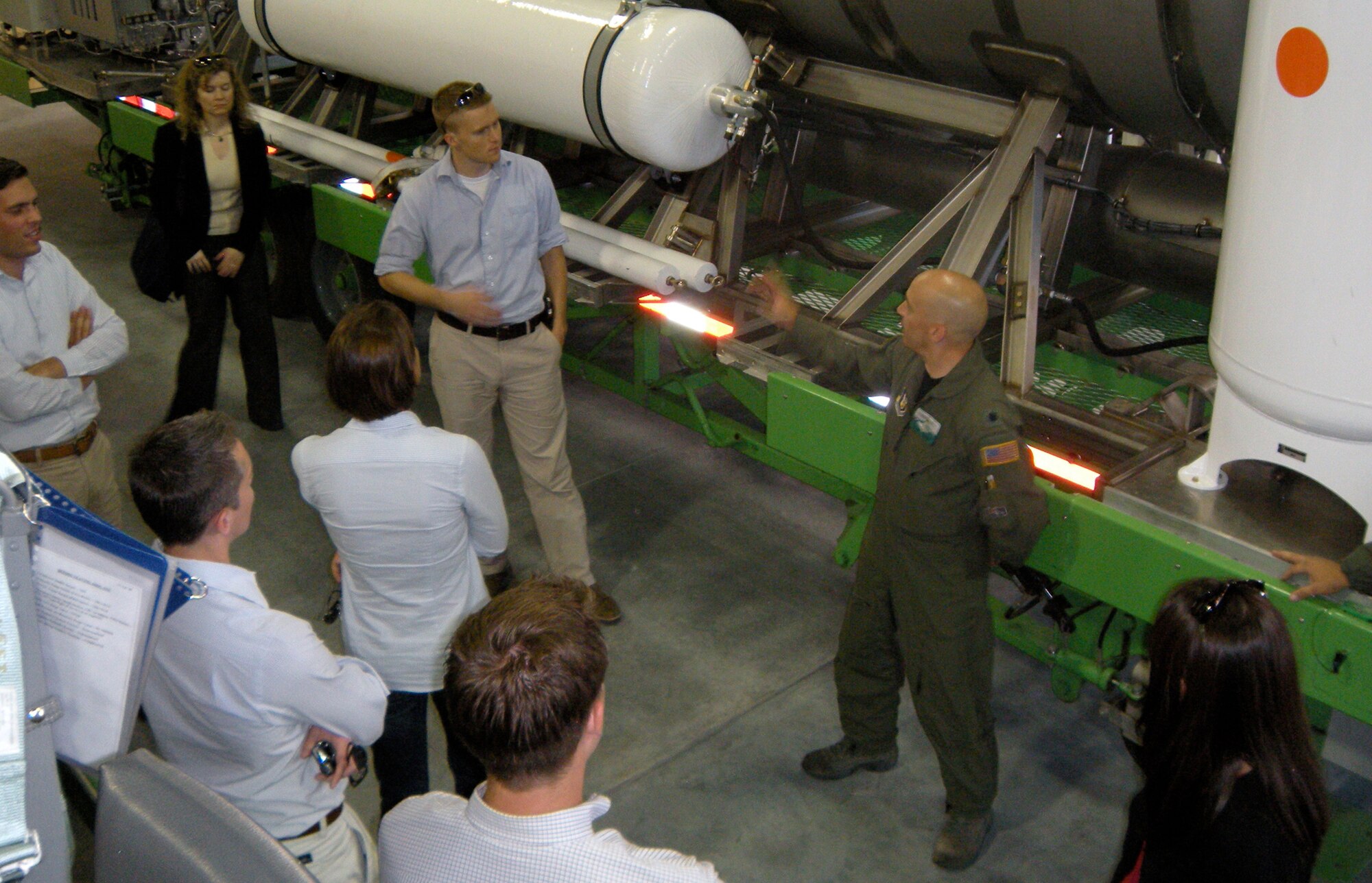 Lt. Col. David Condit, 302nd Airlift Wing chief of safety and Modular Airborne Firefighting Systems coordinator for the Air Force Reserve, shows the 'MAFFS II' system to Congressional staffers August 27 at Peterson Air Force Base, Colo. The staffers, from Colorado, California and Delaware, visited the 302nd AW after receiving a 'From The Field' brief in early August on the AF Reserve's civil support mission of aerial firefighting, located exclusively at Peterson. The staffers also received a local orientation flight through the Rocky Mountains, giving them a better understanding of the capabilities of the C-130 Hercules tactical transport aircraft. (U.S. Air Force photo/Staff Sgt. Stephen J. Collier)