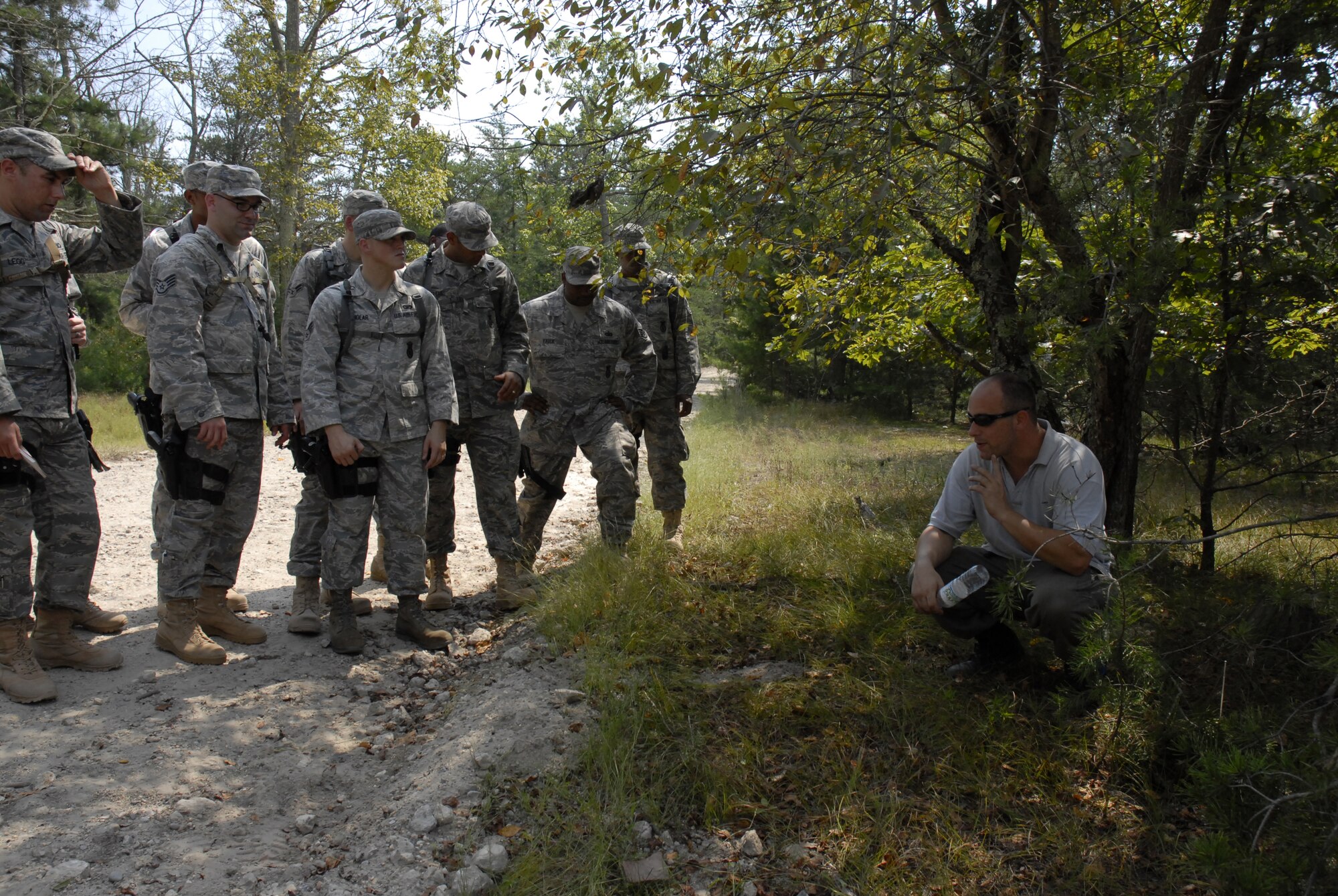 An EOD instructor, Mr. David Leventhal, shows security forces students what signs to look for to detect an IED placed on their convoy route during a training exercise on a Fort Dix range, August 26, 2009, conducted by the 421st Combat Training Squadron hosted by the U.S. Air Force Expeditionary Center, Joint Base McGuire-Dix-Lakehurst, N.J. (U.S. Air Force Photo/Tech. Sgt. Paul R. Evans)
