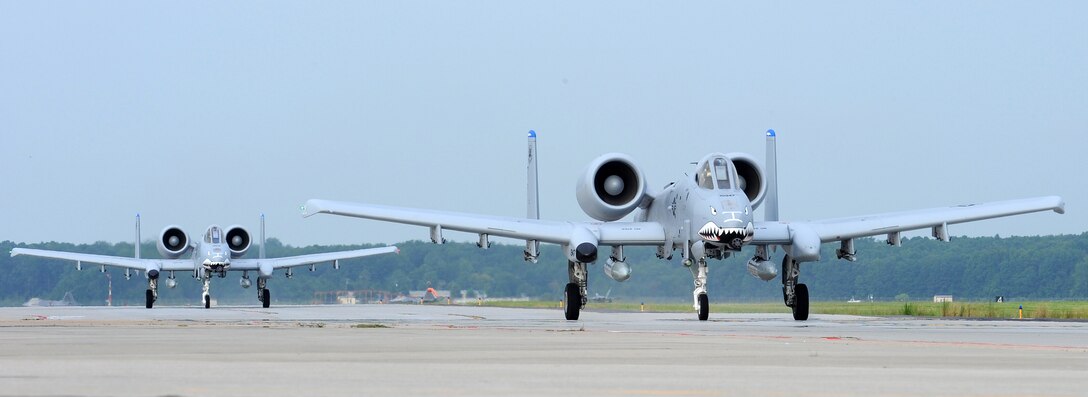 LANGLEY AIR FORCE BASE, Va. --  Two A-10 Thunderbolt II's taxi to the runway here Aug. 28.  The two A-10's are from the 76th Fighter Squadron at Moody AFB and took off from Langley prior to a flyover at Arlington National Cemetery, Va. in honor of Lt. Col. (retired) Vernon Kramer, a World War II veteran.  (U.S. Air Force photo/Senior Airman Zachary Wolf)
