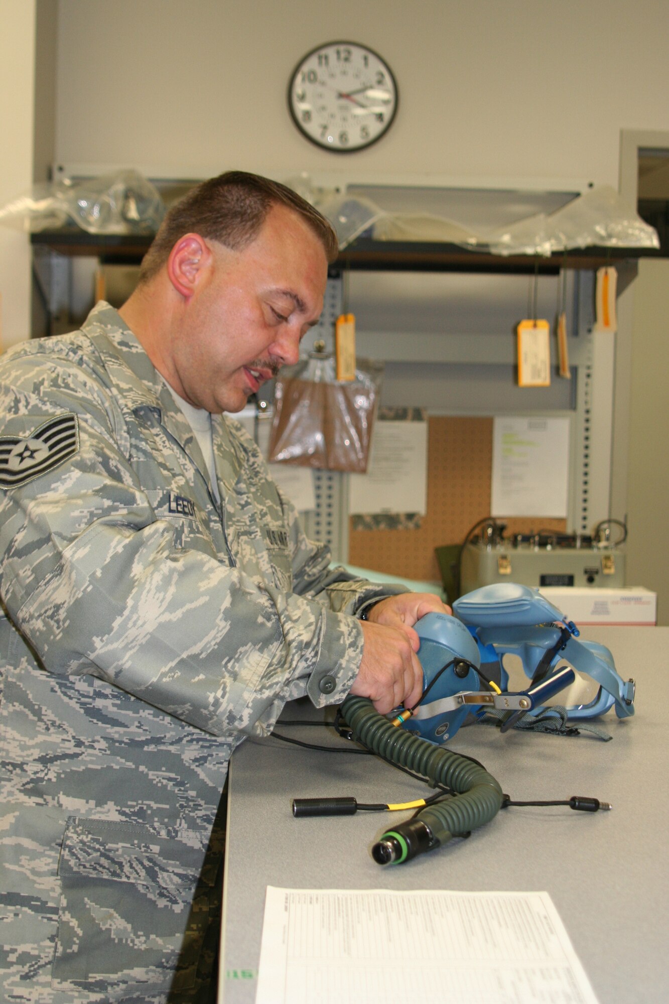 WRIGHT-PATTERSON AFB, Ohio - Tech. Sgt. Tim Leedy, 445th Operations Support Squadron, Aircrew Flight Equipment Section, inspects a 358 smoke mask.  The smoke mask is used for aircrew in the event of fire or smoke on the C-5 Galaxy flight deck.  There are 21 masks on the flight deck of each C-5. Each mask must be inspected every 30 days which means the aircrew flight equipment section must inspect 210 masks each month. (Air Force photo/Staff Sgt. Amanda Duncan)