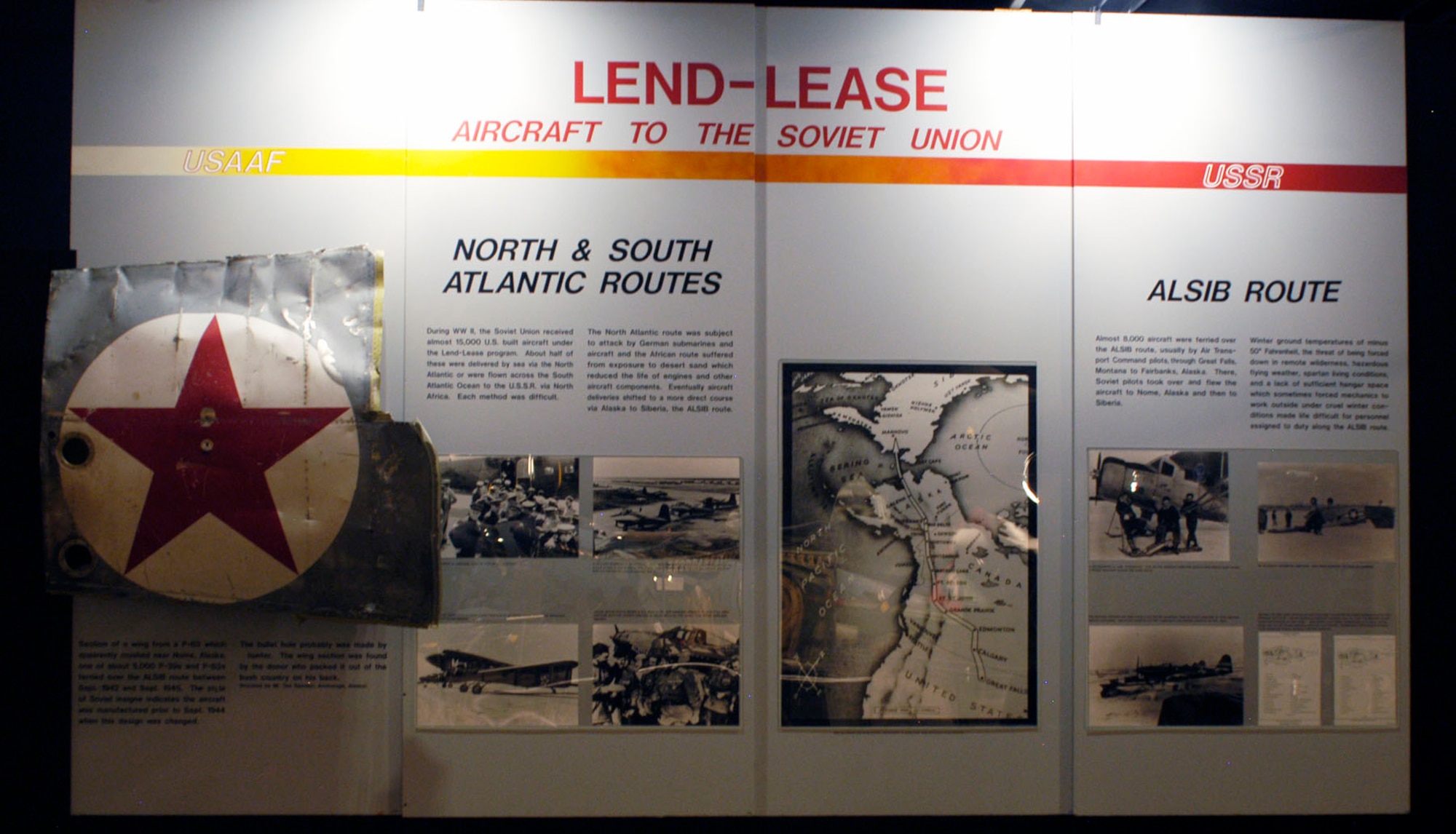 DAYTON, Ohio -- Lend-Lease exhibit in the World War II Gallery at the National Museum of the U.S. Air Force. The exhibit includes a section of a wing from a P-63 that apparently crashed near Nome, Alaska, one of about 5,000 P-39s and P-63s ferried over the ALSIB route between September 1942 and September 1945. (U.S. Air Force photo)