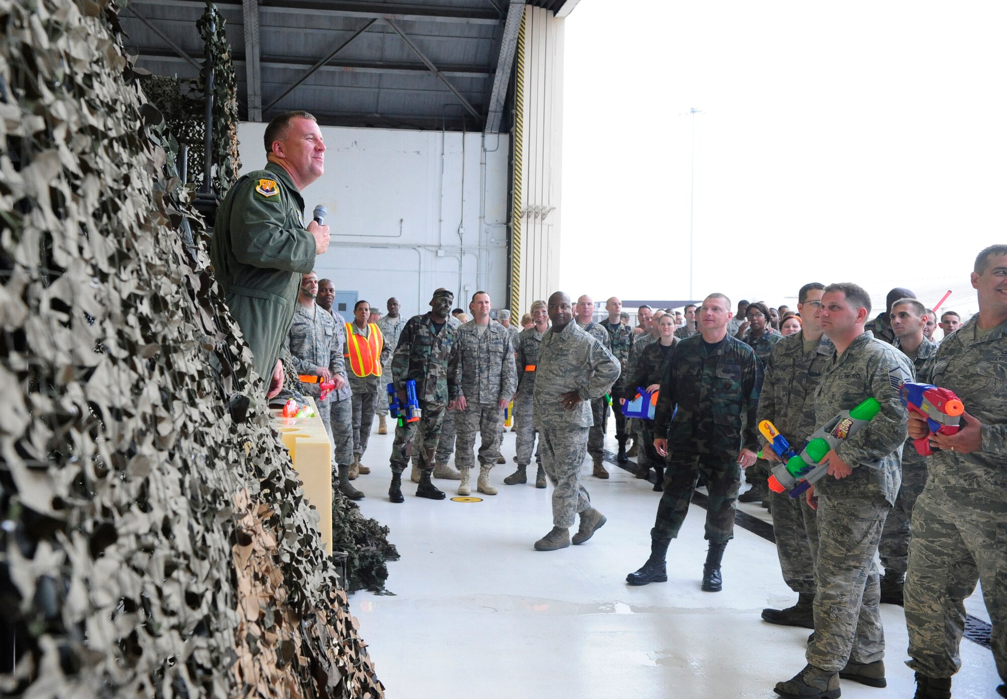 Col. Larry Martin, 6th Air Mobility Wing Commander, addresses enlisted servicemembers during the beginning of the Enlisted Combat Dining In at Hangar 1 here Aug. 21.  More than 350 service members participated in the dining in, which consisted of a night of fun and camaraderie.  (U.S. Air Force photo by Rylan Albright/Released)