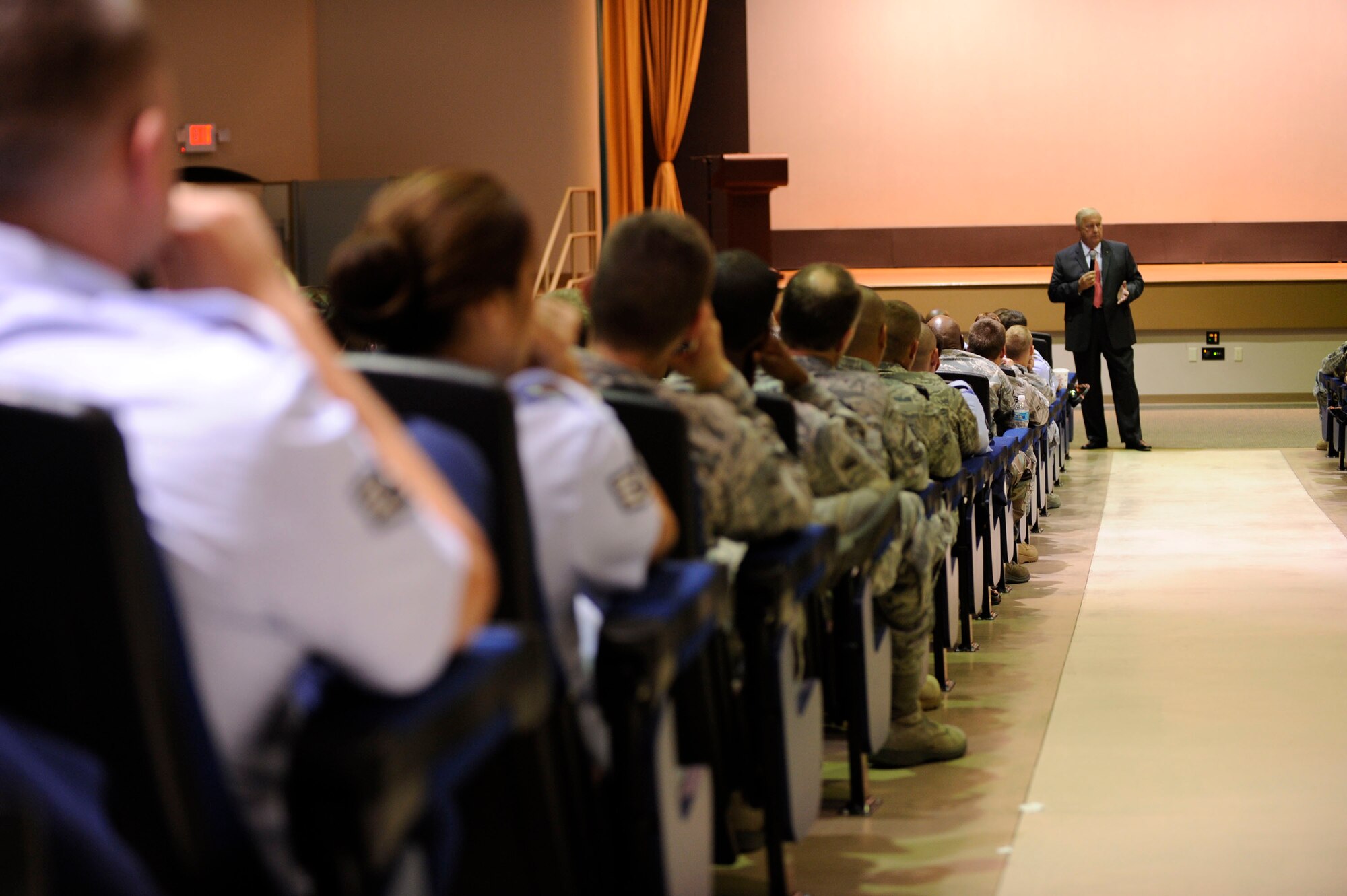 The 9th Chief Master Sgt. of the Air Force James C. Binniker speaks to the enlisted core of MacDill Air Force Base at the Base Theater here Aug. 24.Chief Binnicker participated in a facility dedication ceremony in honor of Chief Master Sgt. (Ret.) Donald "Dewey" Short. The fitness center was renamed Short Fitness and Sports Center in honor of Chief Short. During his visit, Chief Binnicker visited with Airmen, noncommissioned officers and senior NCOs from across the wing. He wrapped up his visit by sharing knowledge and experience at the enlisted call. (US Air Force Photo By: Senior Airman Angela Ruiz/Released)
