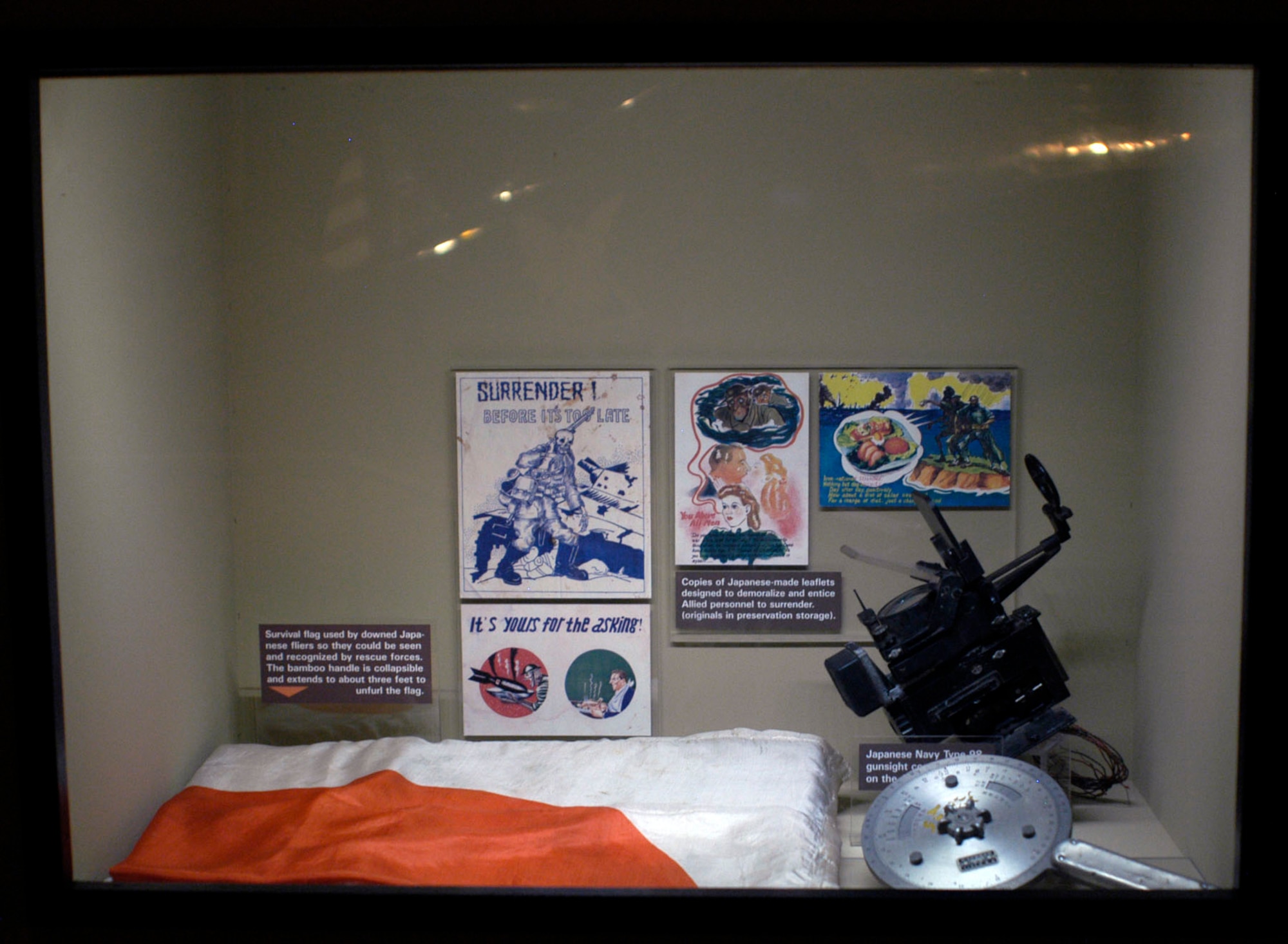 DAYTON, Ohio -- Japanese artifacts, including Japanese-made leaflets, a survival flag used by downed Japanese flyers, and a Japanese gunsight, are on display in the World War II Gallery at the National Museum of the U.S. Air Force. (U.S. Air Force photo)