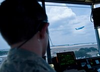 Staff Sgt. Robert Butler, 37th Operations Support Squadron, watches a C-5 as it  takes off from Lackland's flight line. Air traffic controllers with the 37th OSS are responsible for all movement that takes place on the Kelly Field Annex and Lackland Air Force Base flight line. (U.S. Air Force photo/Senior Airman Christopher Griffin)