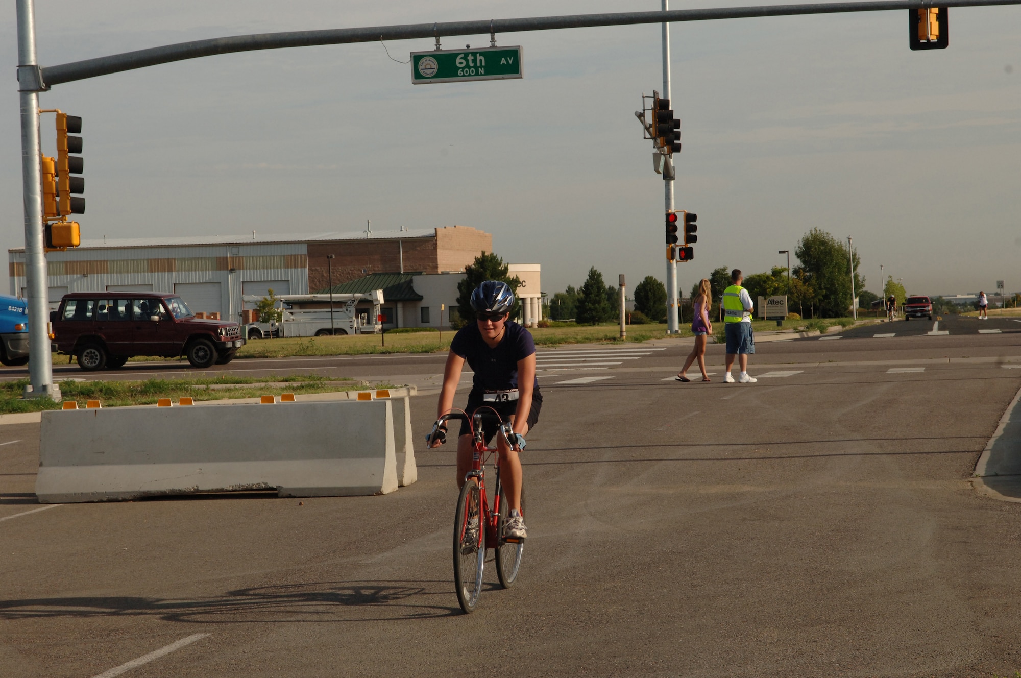 Lisa Wermuth bikes through the Telluride Gate Aug. 23 during the second stage mini-triathlon, the 12-mile bike ride. (U.S. Air Force photo by Tech. Sgt. Shirley Henderson)