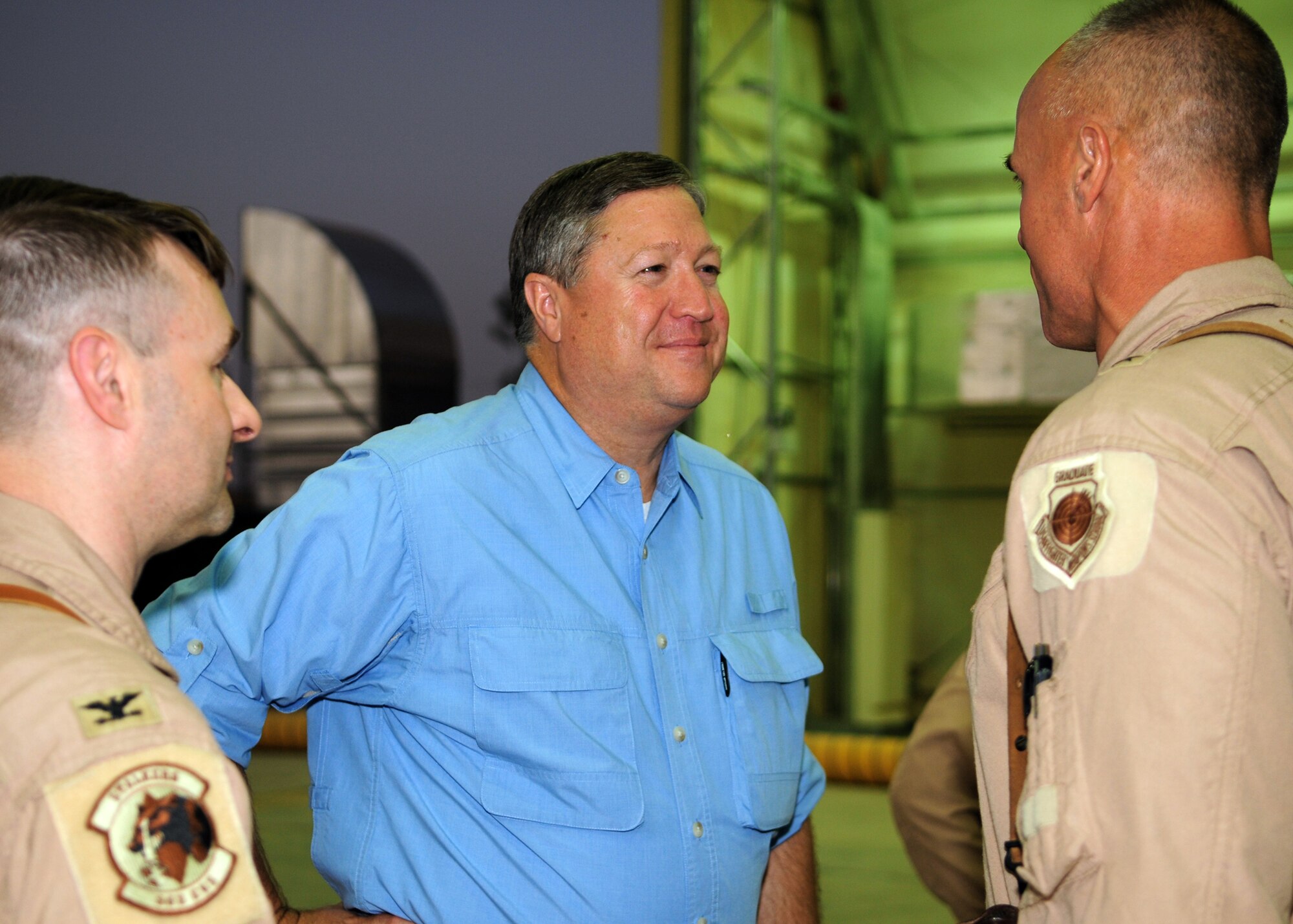 Secretary of the Air Force Michael Donley discusses on-going operations with Col. Luke Grossman (left), 332nd Air Expeditionary Wing vice commander, and Brig. Gen. Craig Franklin, 332nd AEW commander, Aug. 27 during a tour of the MC-12 Liberty aircraft hangar at Joint Base Balad, Iraq.  The 332nd AEW employs the spectrum of airpower capability throughout the Iraqi theater of operations in support of ground forces and Iraqi capacity-building, including strike; airlift and airdrop; combat search and rescue; aeromedical evacuation; and intelligence, surveillance and reconnaissance.  Secretary Donley visited the base to meet with the Airmen there and to get a first-hand look at the 332nd AEW's diverse mission.   (U.S. Air Force photo/Staff Sgt. Heather M. Norris)