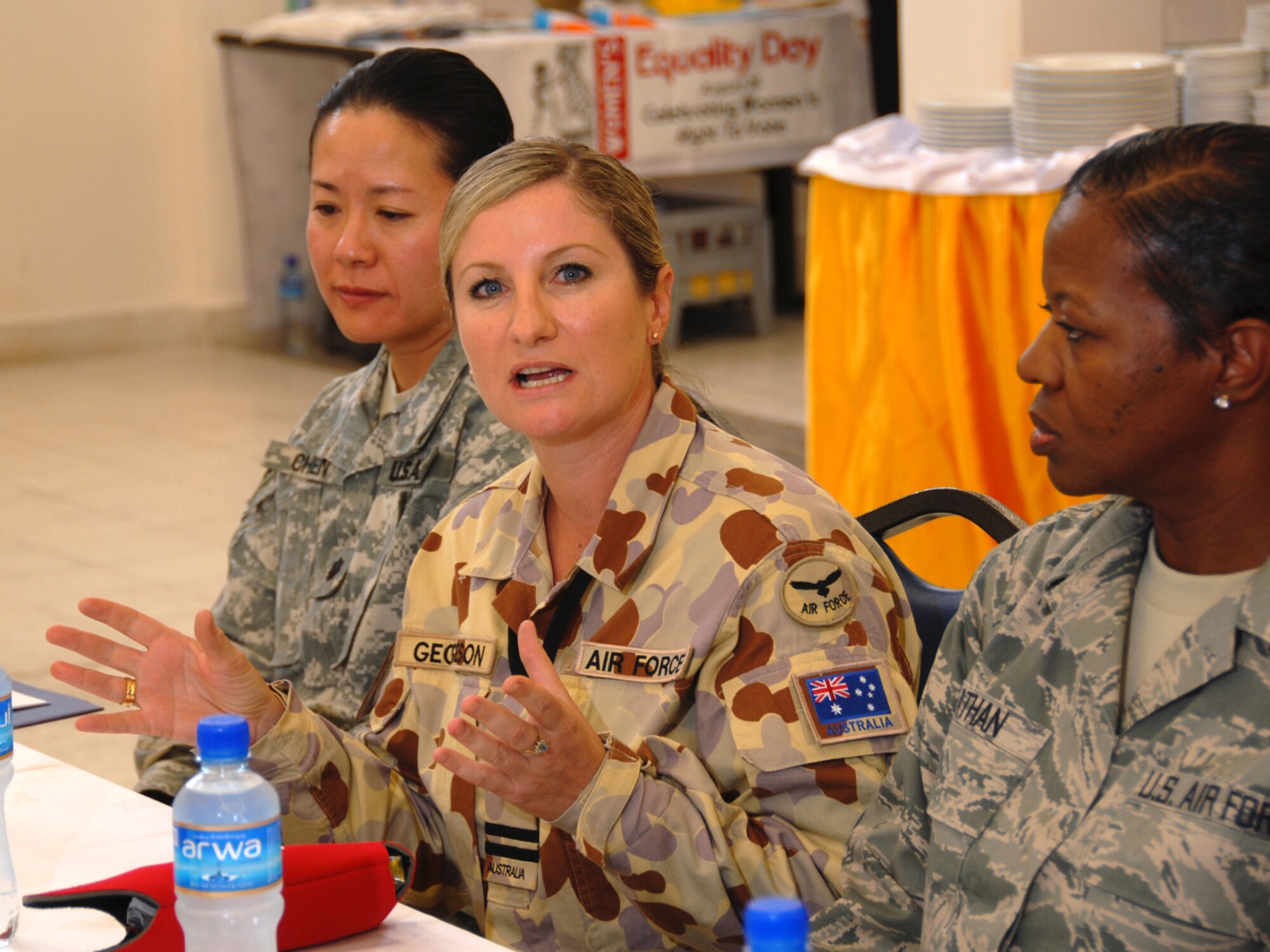 Center, Royal Australian Air Force Flight Lieutenant Kerry Georgeson answers a question about issues facing women in military service. The open forum luncheon was hosted by the 379th Air Expeditionary Wing in observance of Women's Equality Day, here, Aug. 26. Women's Equality Day was established in 1971, commemorating the passage of the 19th Amendment, which gave women in the U.S. full voting rights in 1920. (U.S. Air Force Photo/Tech. Sgt. Jason W. Edwards) 