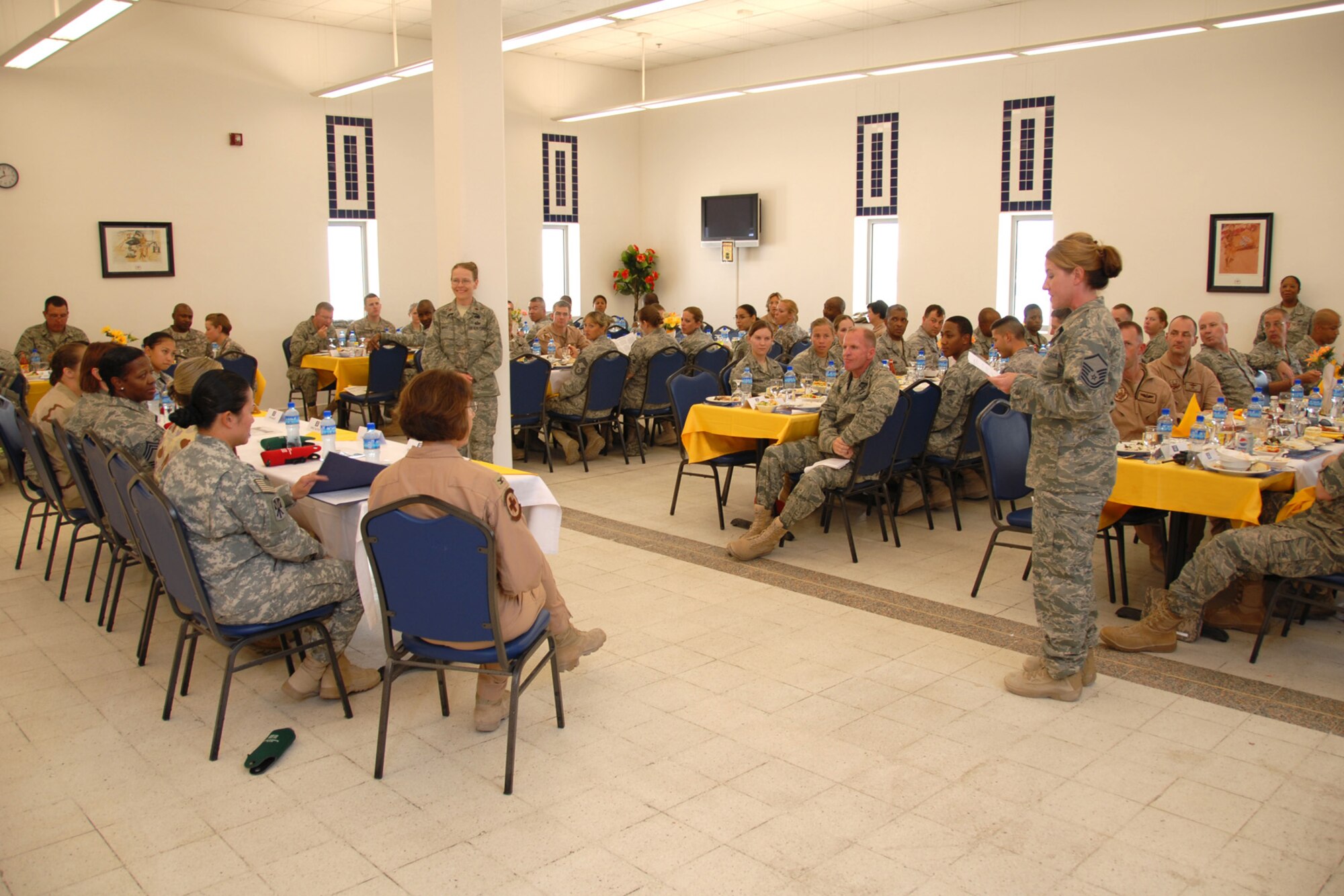 A panel of female servicemembers from various services and career fields answers questions from attendees addressing issues facing women in military service. The open forum luncheon was hosted by the 379th Air Expeditionary Wing in observance of Women's Equality Day, here, Aug. 26. Women's Equality Day was established in 1971, commemorating the passage of the 19th Amendment, which gave women in the U.S. full voting rights in 1920. (U.S. Air Force Photo/Tech. Sgt. Jason W. Edwards) 