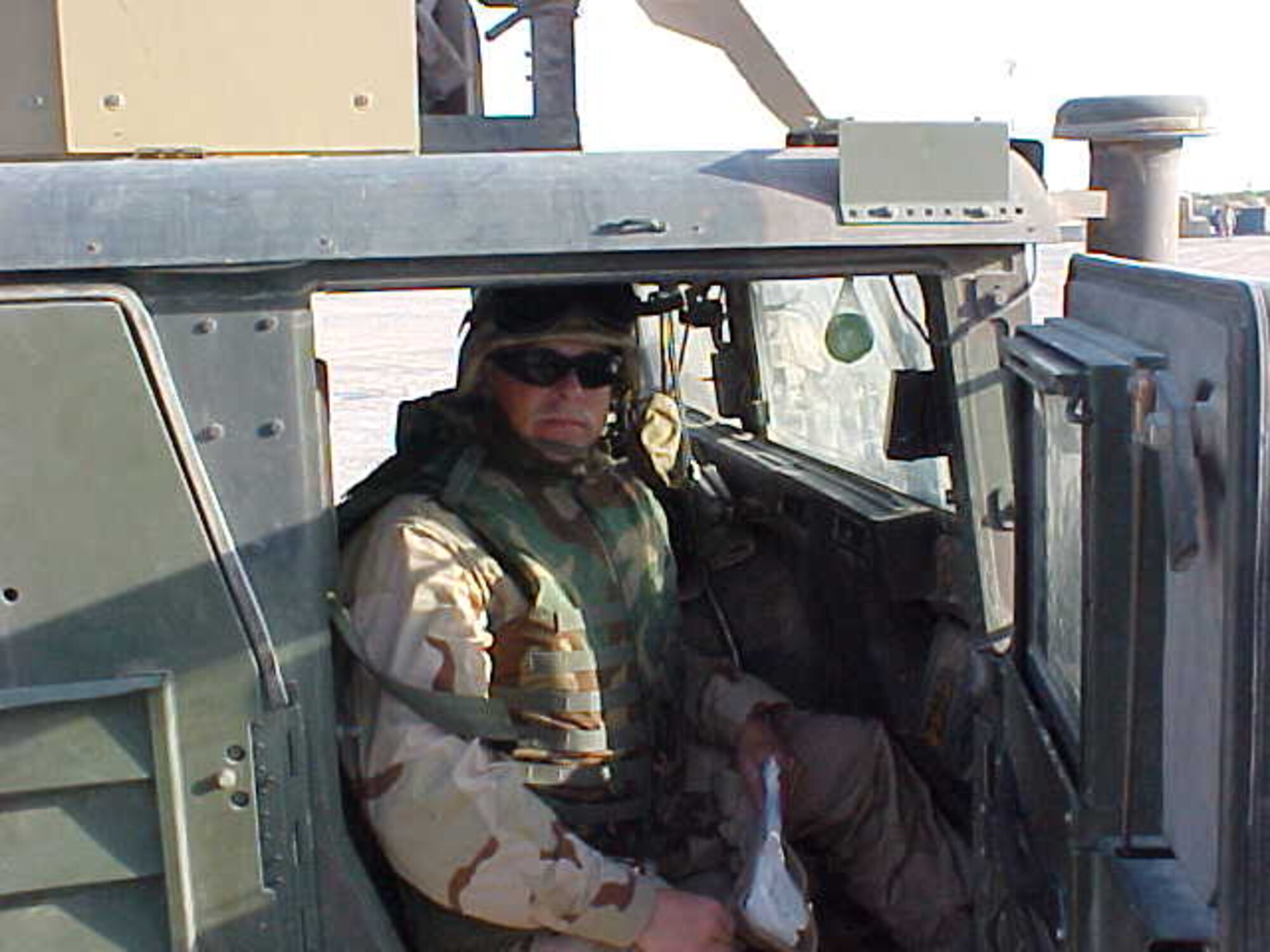 WRIGHT-PATTERSON AFB, Ohio - Chaplain Bill Dickens travels in a convoy from Nav-star, Kuwait to Camp Bucca, Iraq during his 2005 deployment. Chaplain Dickens, who leaves the 445th Airift Wing in November after more than 13 years, was recognized as the Reserve Officer Association's Chaplain of the Year for 2008.  Chaplain Dickens and the 445th Airlift Wing Chaplain Staff received numerous honors and recognition during his tenure with the 445th to include the Air Force Reserve command Outstanding Chaplain Corps Program for 2007-2008; and excellent rating during the unit's operational readiness inspection; and special recognition during the unit staff assistance visit. Chaplain Dickens is being assigned to 10th Air Force. (Courtesy photo)