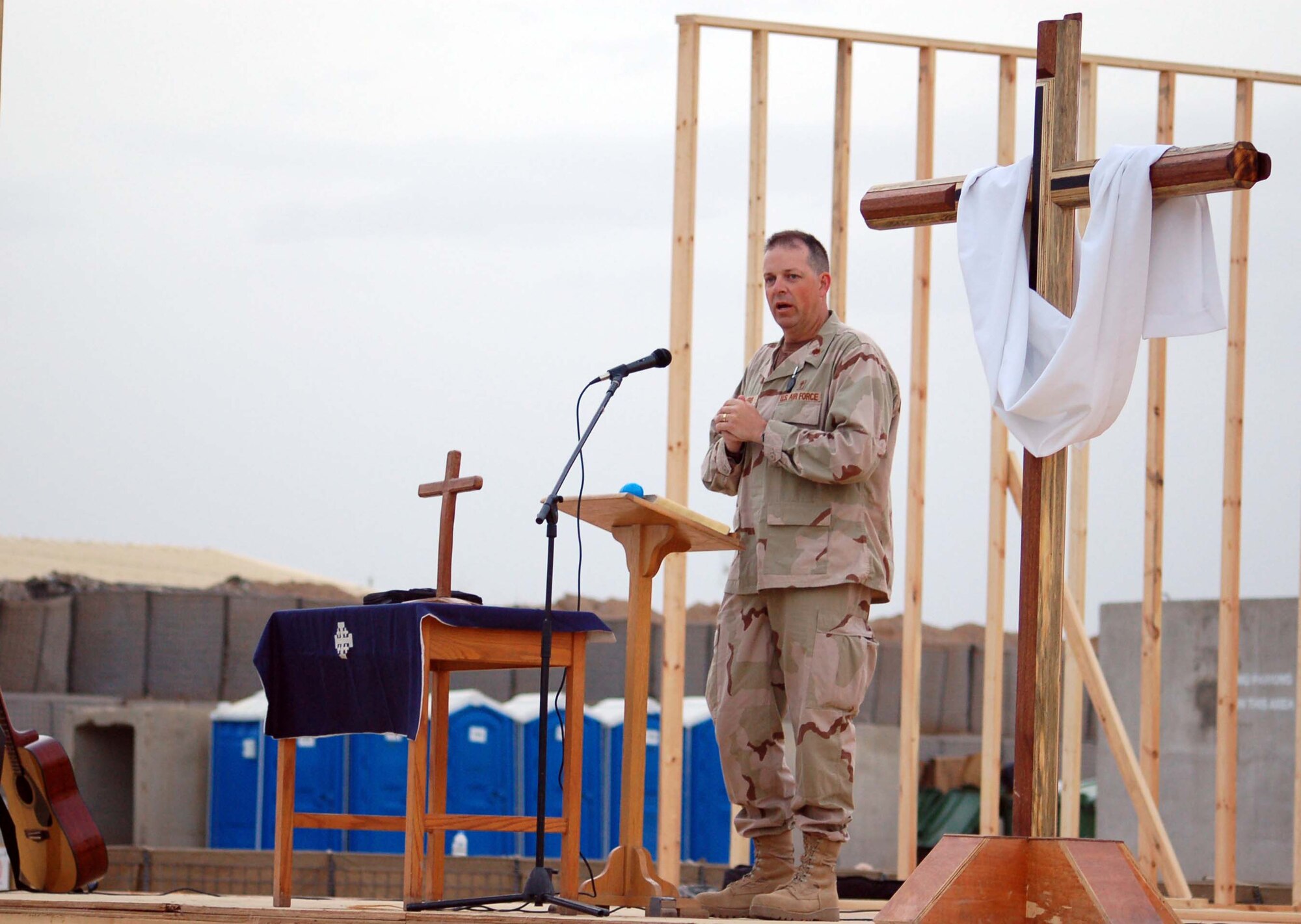WRIGHT-PATTERSON AFB, Ohio - Chaplain Bill Dickens preaches at an Easter Sunrise Service at Forward Operating Base Warrior, Kirkuk, Iraq in 2007.  Chaplain Dickens, who leaves the 445th Airift Wing in November after more than 13 years, was recognized as the Reserve Officer Association's Chaplain of the Year for 2008.  Chaplain Dickens and the 445th Airlift Wing Chaplain Staff received numerous honors and recognition during his tenure with the 445th to include the Air Force Reserve command Outstanding Chaplain Corps Program for 2007-2008; and excellent rating during the unit's operational readiness inspection; and special recognition during the unit staff assistance visit. (Courtesy photo)