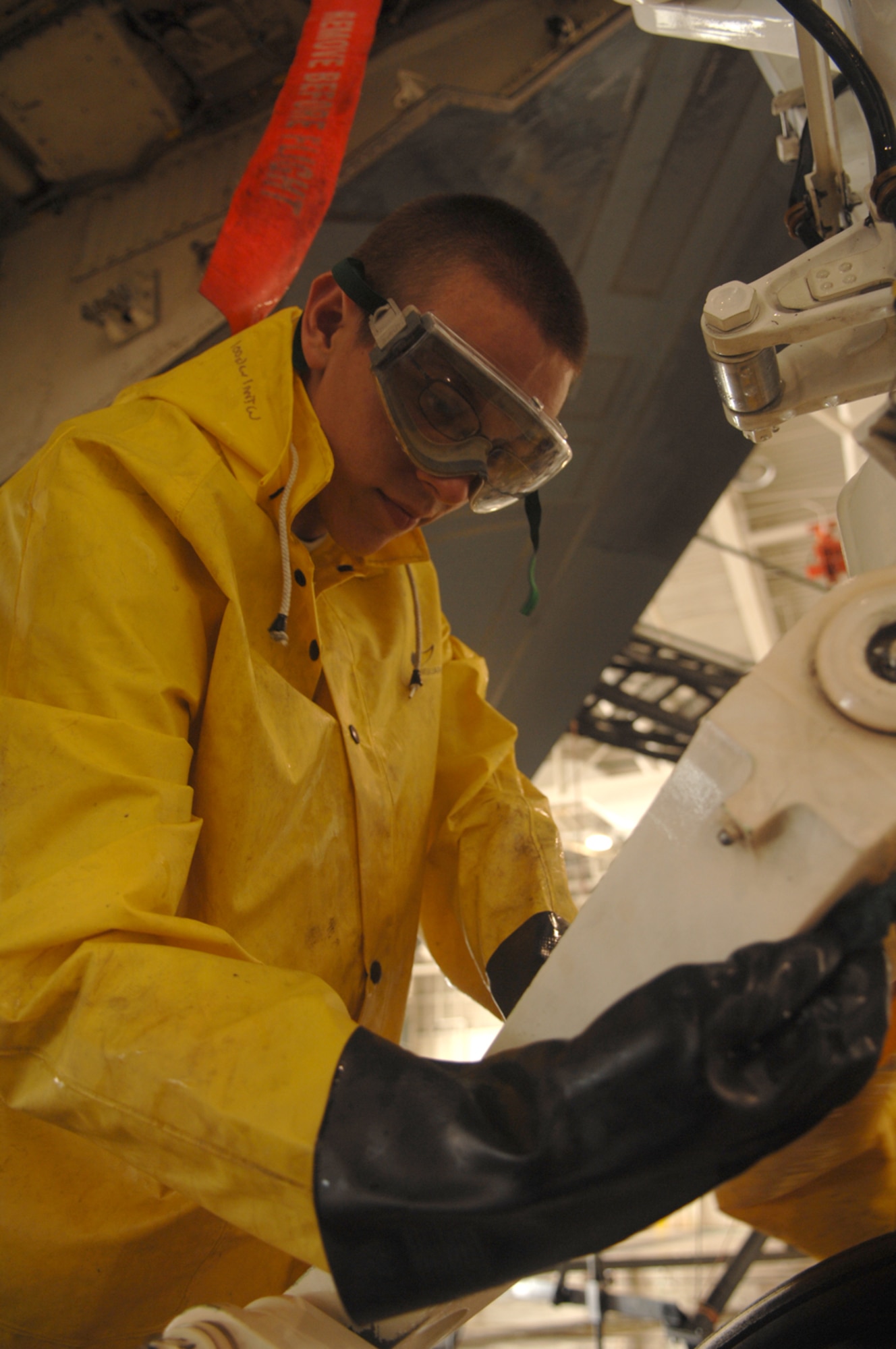 WHITEMAN AIR FORCE BASE, Mo. - Airman 1st Class Matthew Womack, 509th Aircraft Maintenance Squadron crew chief, scrubs down a B-2, Spirit of South Carolina, during a wash Aug. 27.  (U.S. Air Force photo/Senior Airman Jessica Snow)