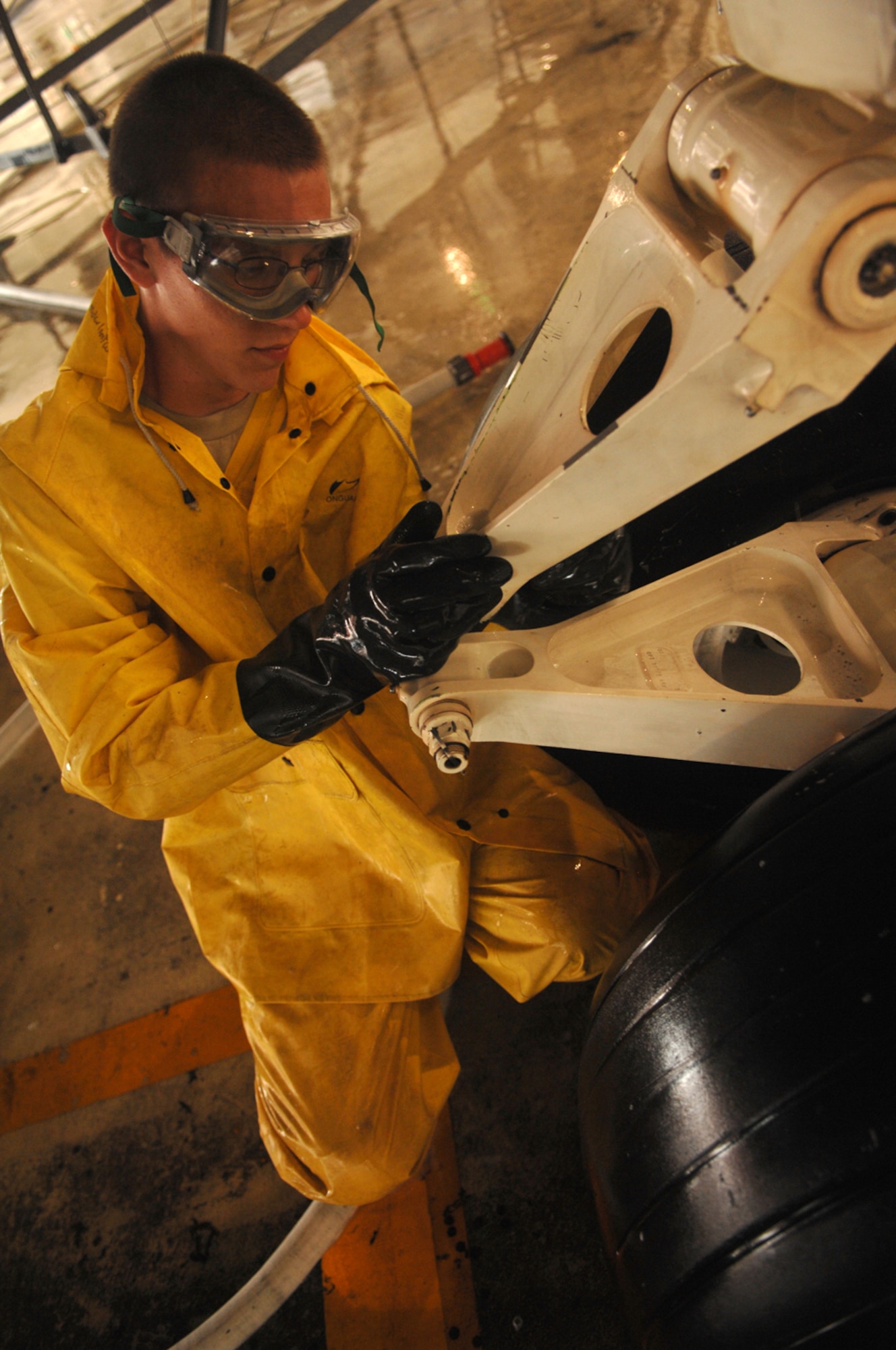 WHITEMAN AIR FORCE BASE, Mo. - Airman 1st Class Matthew Womack, a 509th Aircraft Maintenance Squadron crew chief, scrubs down a B-2, Spirit of South Carolina, during a wash Aug. 27. (U.S. Air Force photo/Senior Airman Jessica 