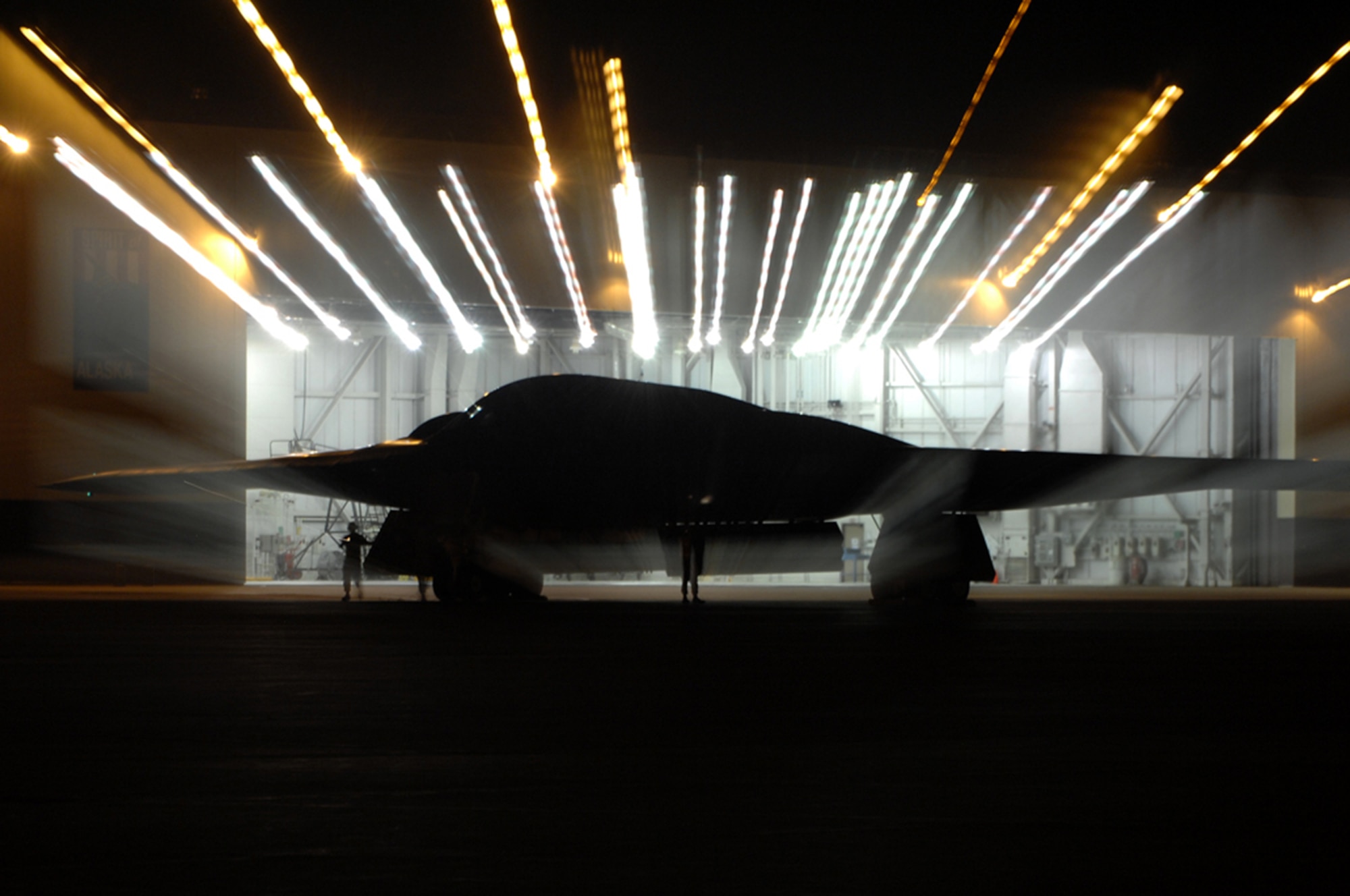 WHITEMAN AIR FORCE BASE, Mo. - Crew Chiefs from the 509th Aircraft Maintenance Squadron prepare to put a B-2 in a dock Aug. 27. Twenty B-2 Spirit aircrafts are assigned to the 509th Bomb Wing. The B-2's primary mission is to attack time-critical targets early in a conflict to minimize an enemy's war-making potential. (U.S. Air Force photo/Senior Airman Jessica Snow)