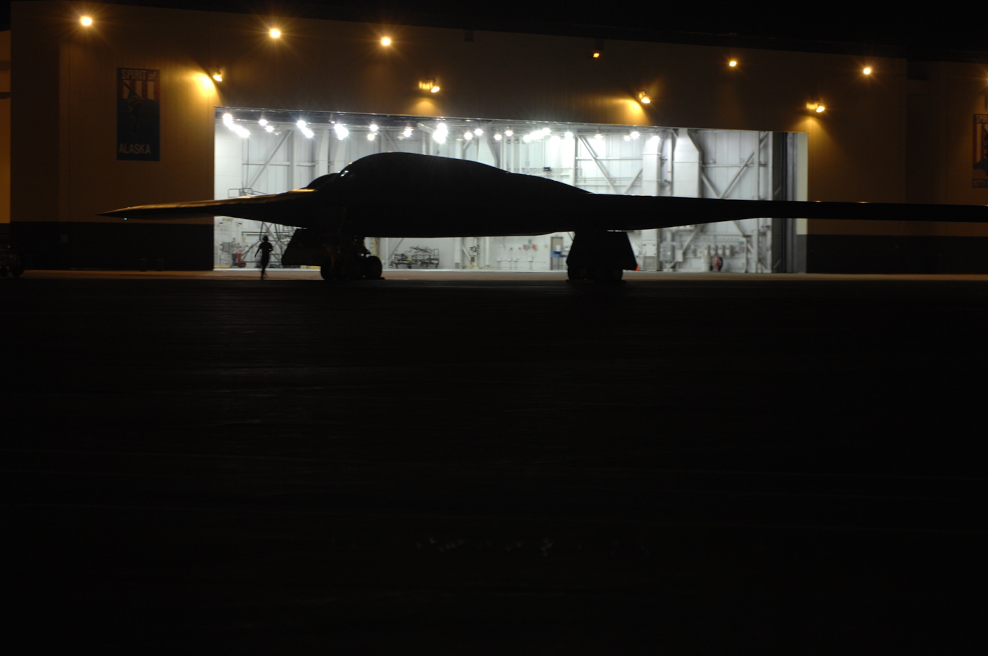 WHITEMAN AIR FORCE BASE, Mo. - Crew chiefs from the 509th Aircraft Maintenance Squadron prepare to put a B-2 in a dock Aug. 27. (U.S. Air Force photo/Senior Airman Jessica Snow)
