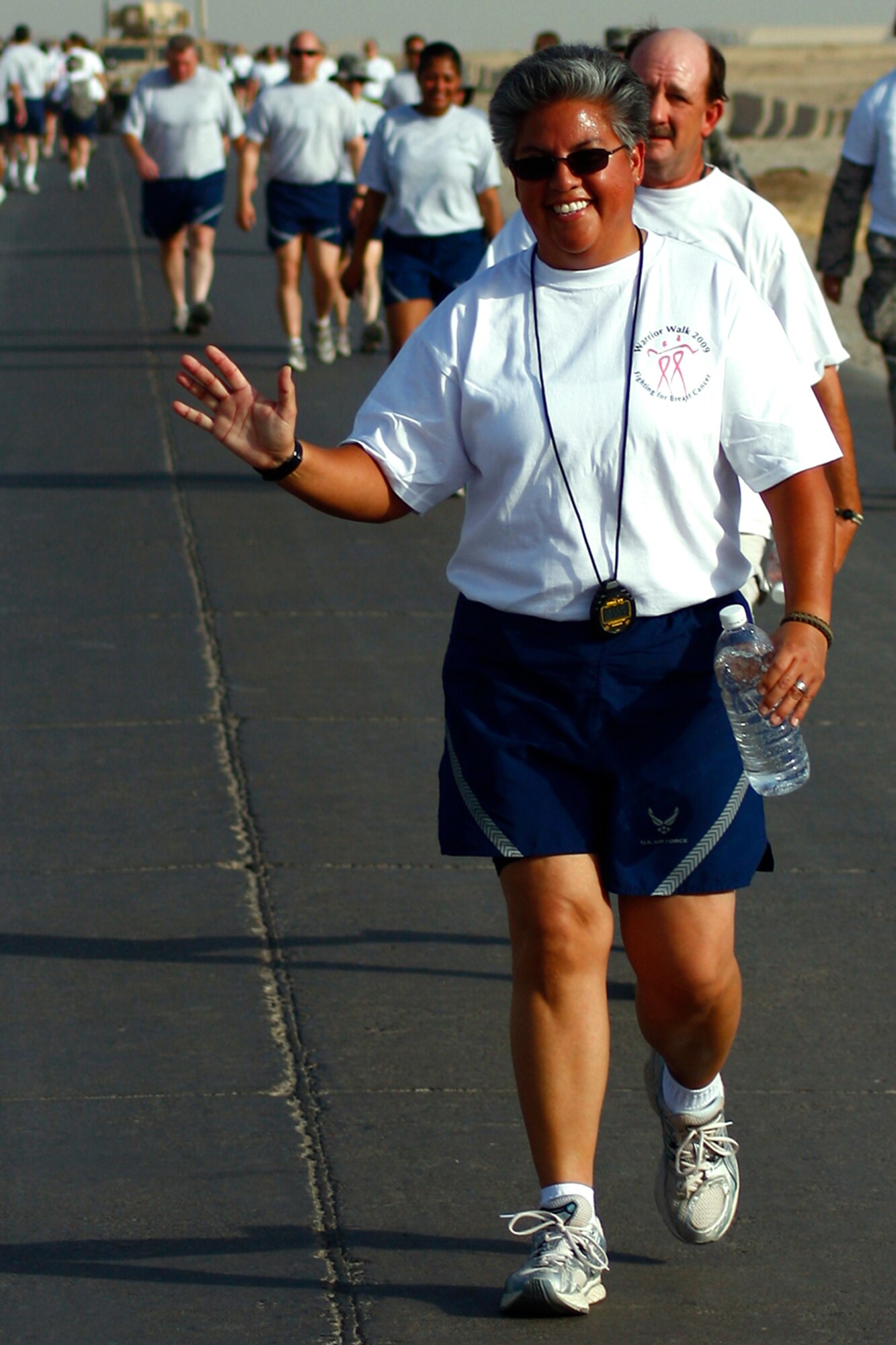 KIRKUK REGIONAL AIR BASE, Iraq -- Master Sgt. Loretta Patino, 506th Expeditionary Logistics Readiness Squadron, participates in the Aug. 20 KRAB Warrior Walk, a benefit she organized which raised $3,100 in donations for breast cancer research and eduation.  Sergeant Patino began to participate in the walk in 2003 to support a close friend diagnosed with the disease.  Sergeant Patino is a reservist deployed here from March Air Reserve Base, Calif. (U.S. Air Force photo/Staff Sgt. Christopher Haddrill)