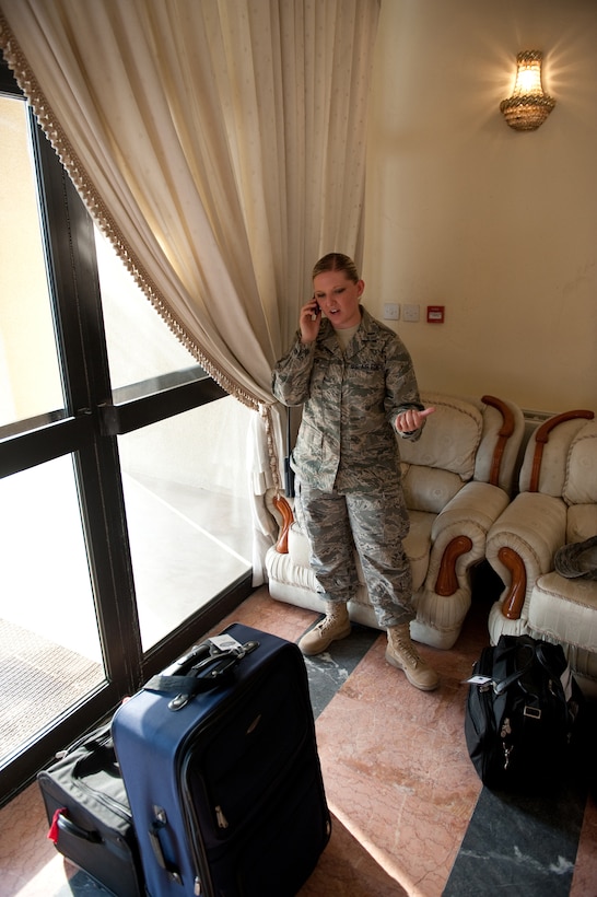 First Lt. Heather Yancy, 379th Air Expeditionary Wing protocol officer, prepares to welcome a distinguished visitor here, Aug. 26. The  protocol office is responsible for the planning, coordination and logistical support of all 379 AEW distinguished visitors. Lieutenant Yancy is a native of Gothenburg, Neb. and is deployed from Langley Air Force Base, Va. in support of Operations Iraqi and Enduring Freedom. (U.S. Air Force photo/Staff Sgt. Robert Barney)