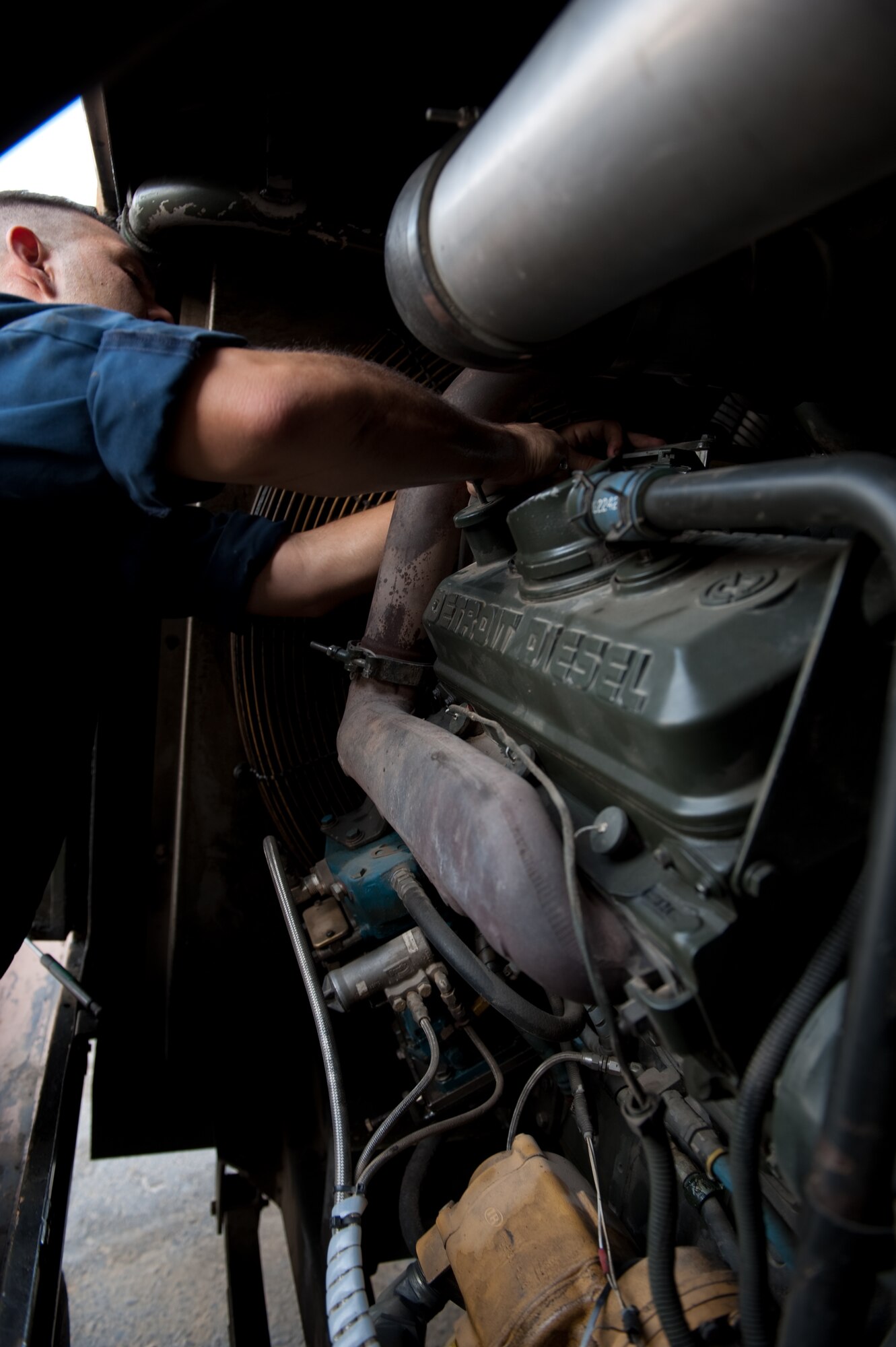 Senior Airman Antonio Rivera, 379th Expeditionary Maintenance Squadron air and ground equipment journeyman, installs an electronic control module on a trilectron generator, Aug. 24, in Southwest Asia. Airmen assigned to 379 EMXS AGE section provide the various ground and support equipment required by aircraft maintainers and inspectors. Airman Rivera is a native of Brooklyn, N.Y. and is deployed from Robins Air Force Base, Ga. in support of Operations Iraqi and Enduring Freedom. (U.S. Air Force photo/Staff Sgt. Robert Barney)
