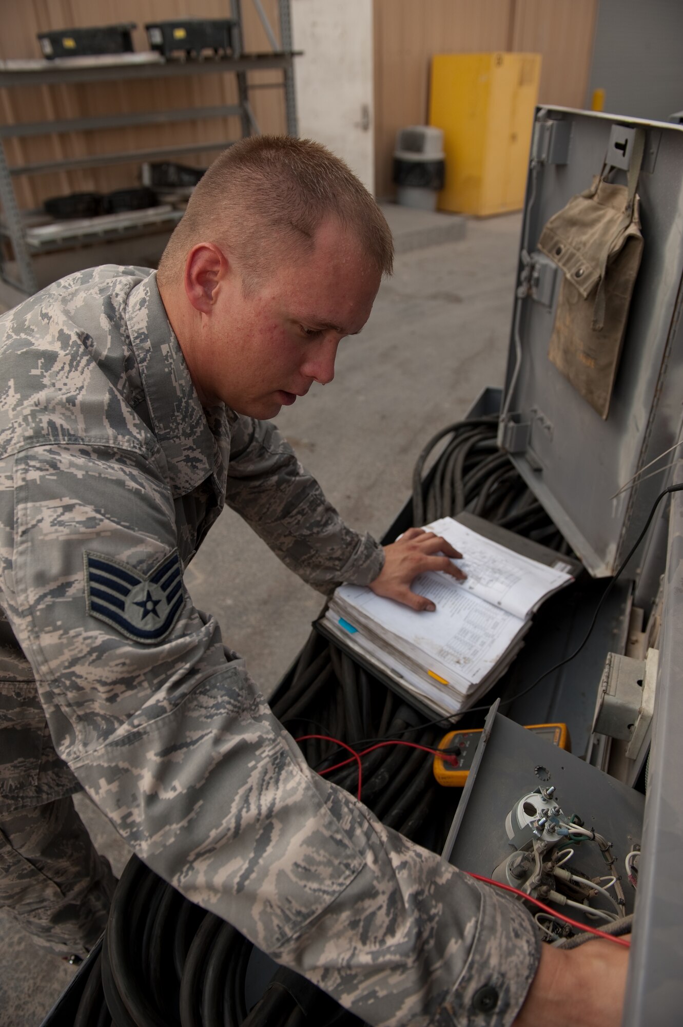 Staff Sgt. Phillip Piddington, 379th Expeditionary Maintenance Squadron air and ground equipment craftsman, performs a voltage check on a diesel generator, Aug. 24, in Southwest Asia. Airmen assigned to 379 EMXS AGE section provide the various ground and support equipment required by aircraft maintainers and inspectors. Sergeant Piddington is a native of Galesville, Wis. and is deployed from MacDill Air Force Base, Fla. in support of Operations Iraqi and Enduring Freedom. (U.S. Air Force photo/Staff Sgt. Robert Barney)