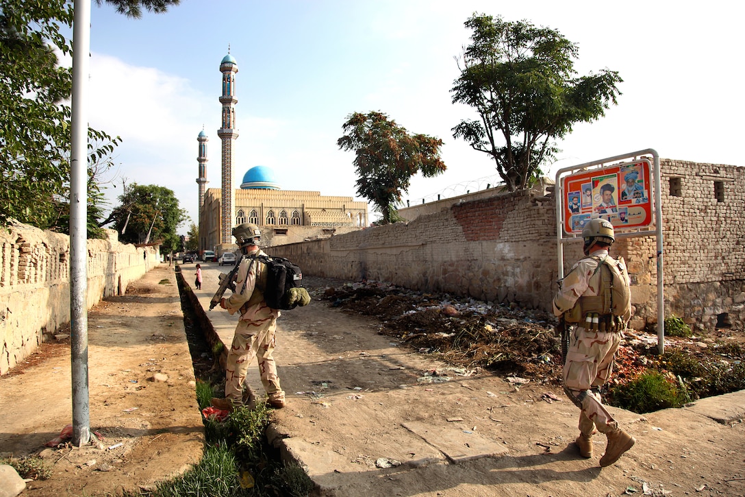Coalition forces patrol the streets in Khost City to provide security to its residents, Afghanistan, Aug. 19, 2009.
