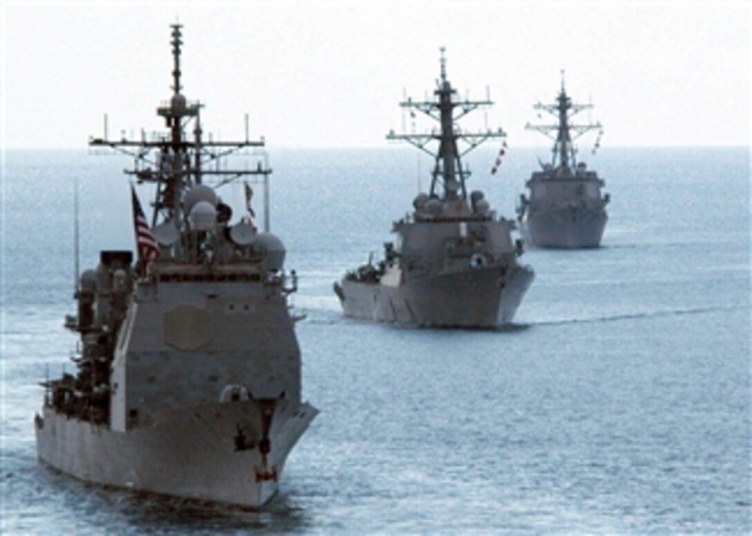 The guided-missile cruiser USS Cowpens (CG 63) and the guided-missile destroyers USS Fitzgerald (DDG 62) and USS Mustin (DDG 89) steam underway during the Indonesian International Fleet Review in the Pacific Ocean on Aug. 19, 2009.  The event commemorates the 64th anniversary of Indonesian independence.  
