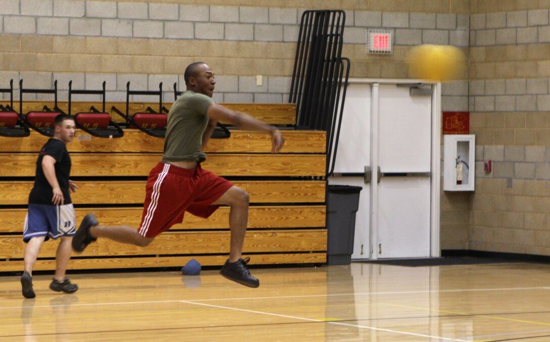 Jeremy Mendoza, weapons technician, Weapons Field Training Battalion, throws a dodge ball at an opposing team member during last year’s Marine Corps Community Services 101 Day of Summer Sport Jam Series dodge ball tournament at Camp Pendleton’s Paige Fieldhouse, Aug. 28. The 101 Days of Summer is a part of the MCCS’ Semper Fit Division’s Sports Jams Series. The three-part series is an effort to prevent drug and alcohol incidences among Camp Pendleton service members.::r::::n::