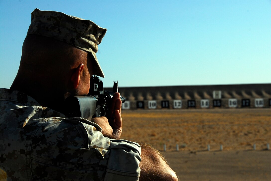 Station commanding officer, Col. Mark Werth, practices his aim on the recently improved rifle range Aug. 28, 2009, on the Barry M. Goldwater Range southeast of the Marine Corps Air Station in Yuma, Ariz., before firing the ceremonial first shot to reopen it. The station's rifle range closed in July for renovations. Shooters can expect to see new firing positions with rubber matting and new target number signs.