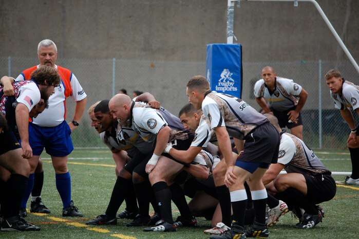 Misfits rugby players set up for a play during one of Camp Lejeune's three games at the Liberty Cup Rugby Tournament, held Aug. 29, in New York. The Misfits were undefeated in their matches against Fire Department New York, New York Police Department and Fort Bragg's Rugby Football Club. The team has five matches scheduled for the fall season and hopes to have several members qualify for the All-Marine Rugby Team later in the year.