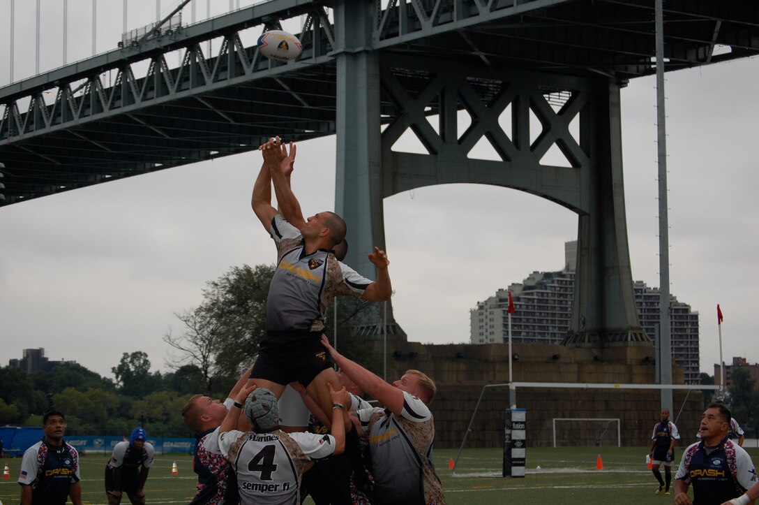 A Misfits rugby player reaches for the ball during one of Camp Lejeune's three games at the Liberty Cup Rugby Tournament, held Aug. 29, in New York. The Misfits were undefeated in their matches against Fire Department New York, New York Police Department and Fort Bragg's Rugby Football Club. The team has five matches scheduled for the fall season and hopes to have several members qualify for the All-Marine Rugby Team later in the year.