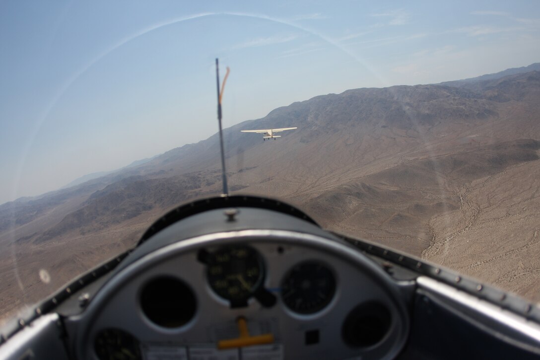 A Cessna Schweitzer 175 Airplane tows a glider behind it after taking off from the Twentynine Palms Airport Aug. 30. This is one of three ways to get a glider in the sky.