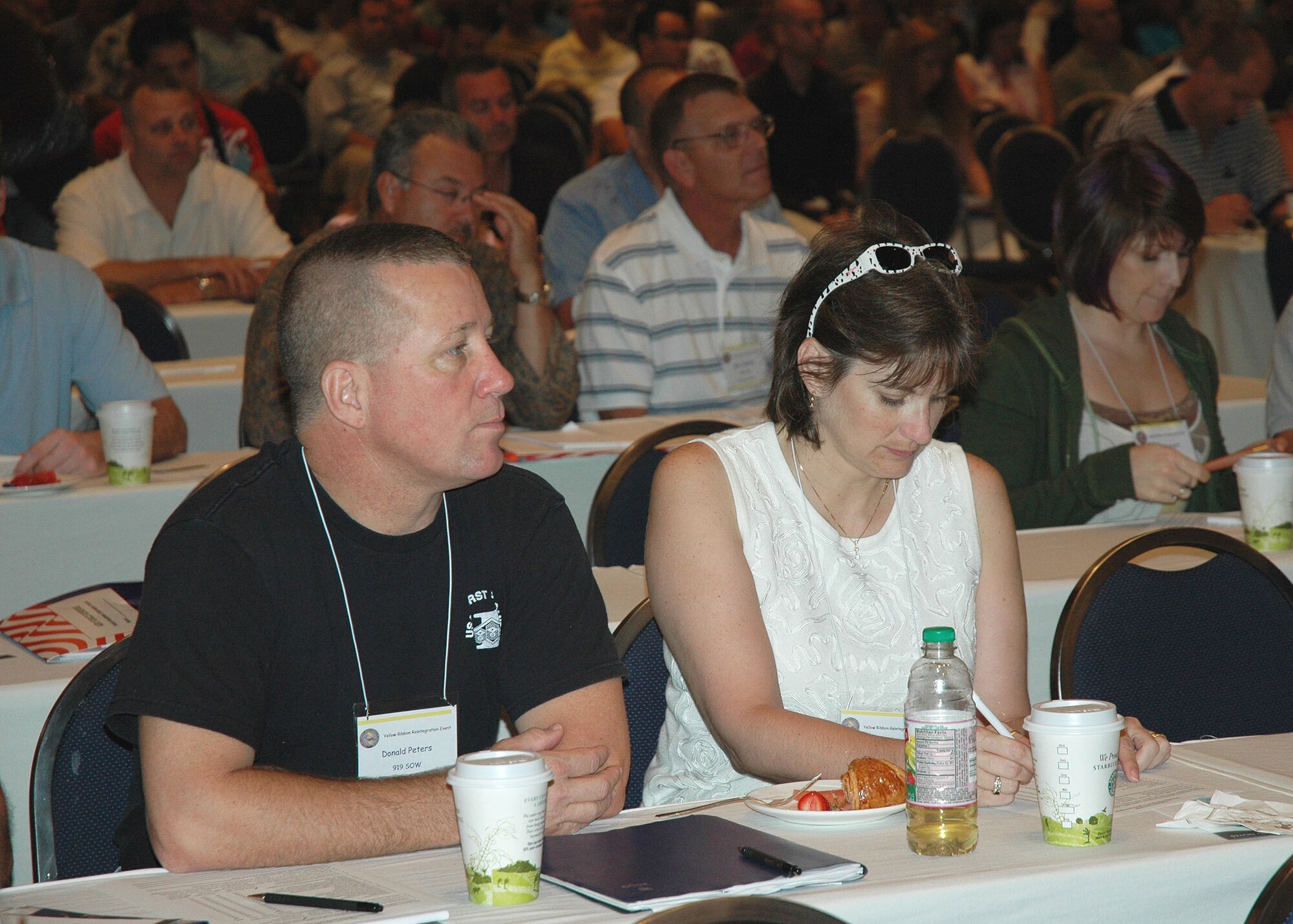 Air Force Reserve Master Sgt. Scott Peters, 919th Medical Squadron first sergeant, and his wife, Yvonne, listen and take notes during a benefits briefing at the Yellow Ribbon Reintegration Program event at the Swan and Dolphin Hotel in Lake Buena Vista, Fla. Aug. 15-16.  The program offers Reserve and Guard members and their families a wealth of benefits information and counseling services throughout the deployment cycle.  The next YRRP event is slated for September 19-20 in Sandestin.