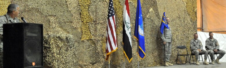 08/26/2009 -SATHER AIR BASE, Iraq, - Col. Pat Savoy, 447th Air Expeditionary Group commander,  says a few words about Lt. Col. Steven Painter, 447th Expeditionary Security Forces Squadron commander seated to the left, during the 447 ESFS change-of-command ceremony here Aug. 26.(U.S. Air Force photo / Staff Sgt. Misty D. Slater)


